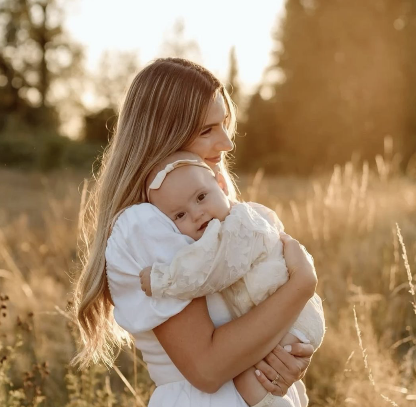 Women holding her newborn baby
