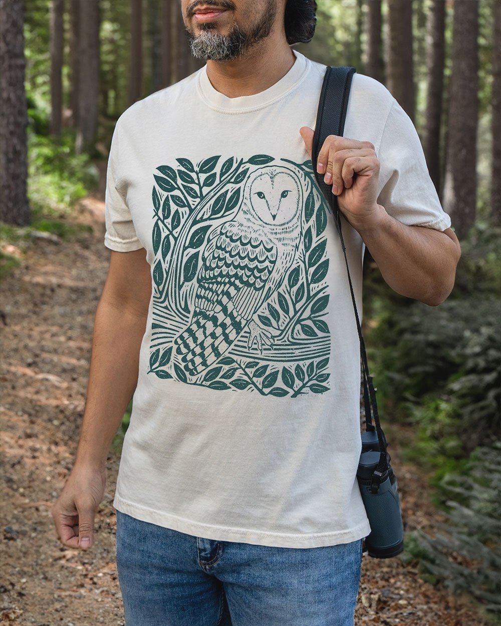 man wearing barn owl t-shirt in ivory, green print