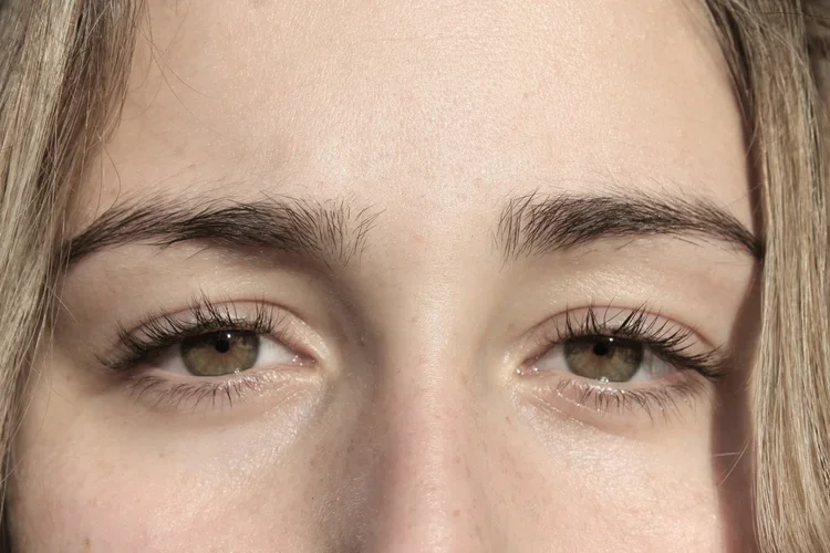 Close-up of a person’s calm, focused eyes during natural light exposure, symbolizing the grounding and bilateral stimulation used in EMDR therapy in California.