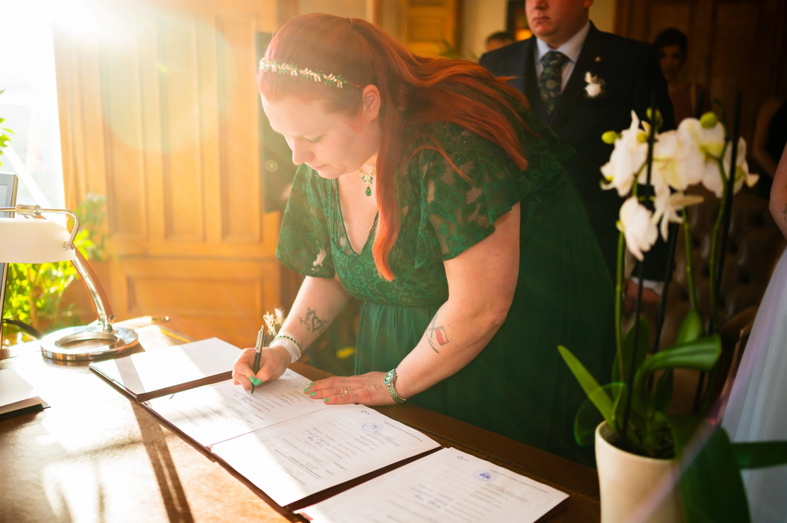 bride groom wedding ceremony family members signing papers