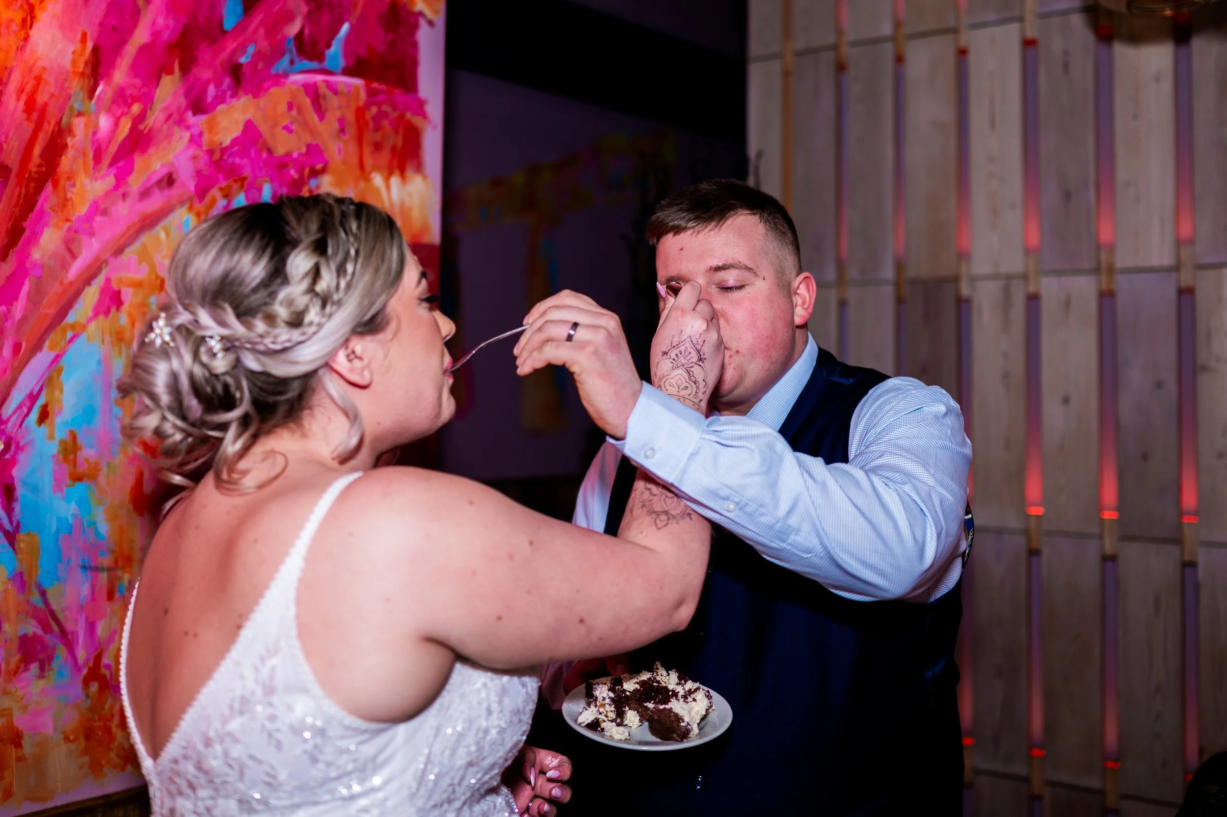 wedding reception restaurant dinner couple feeding each other