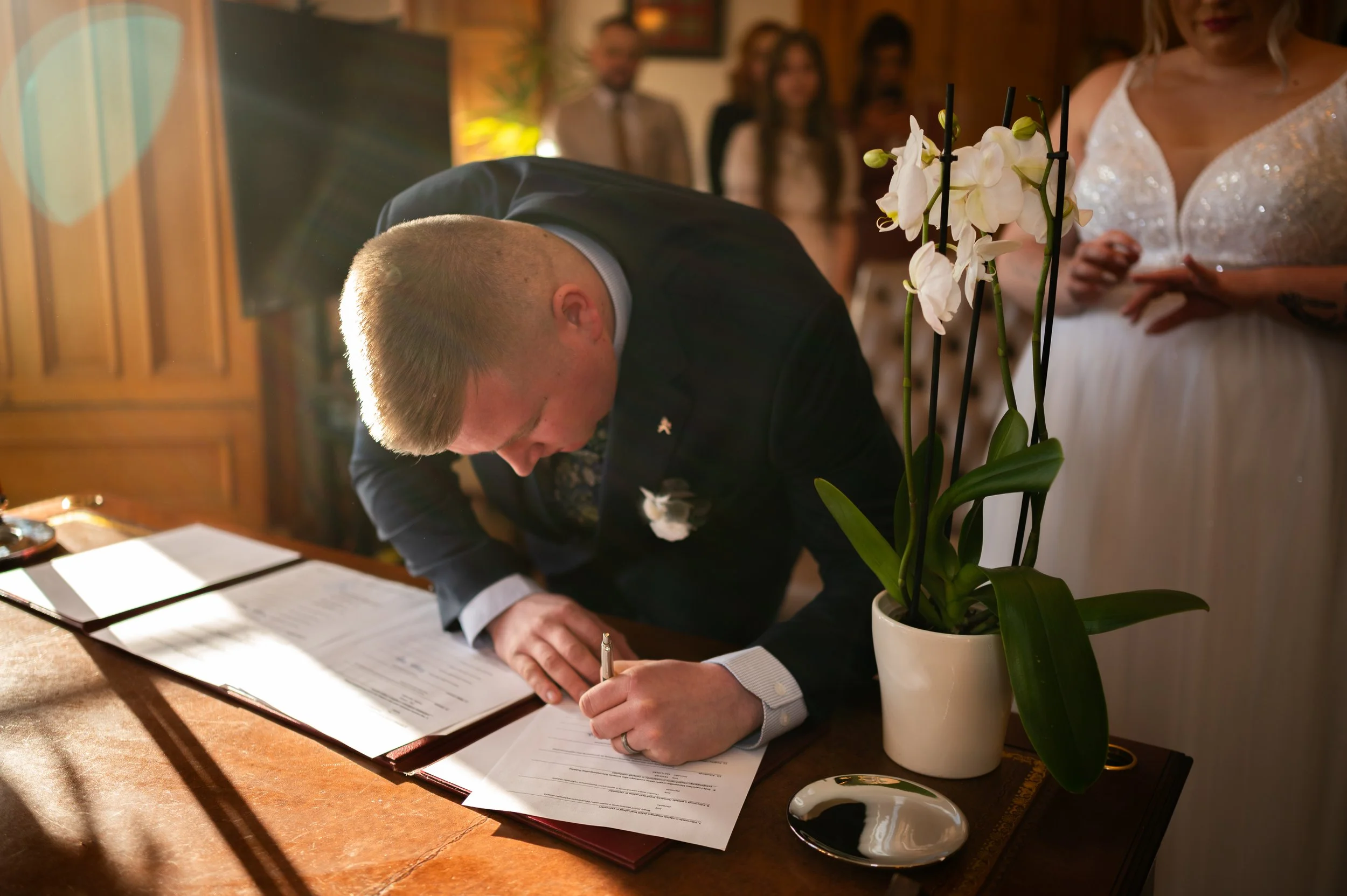 groom wedding ceremony signing papers