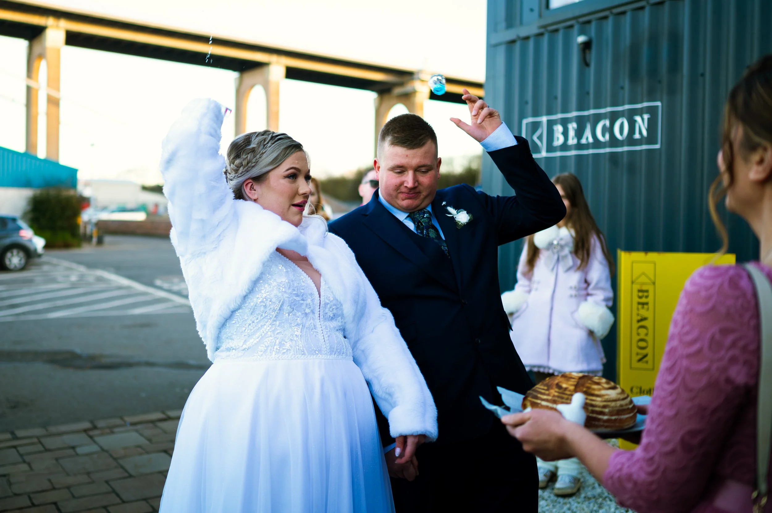 wedding reception restaurant dinner family members couple throwing empty glass behind polish tradition