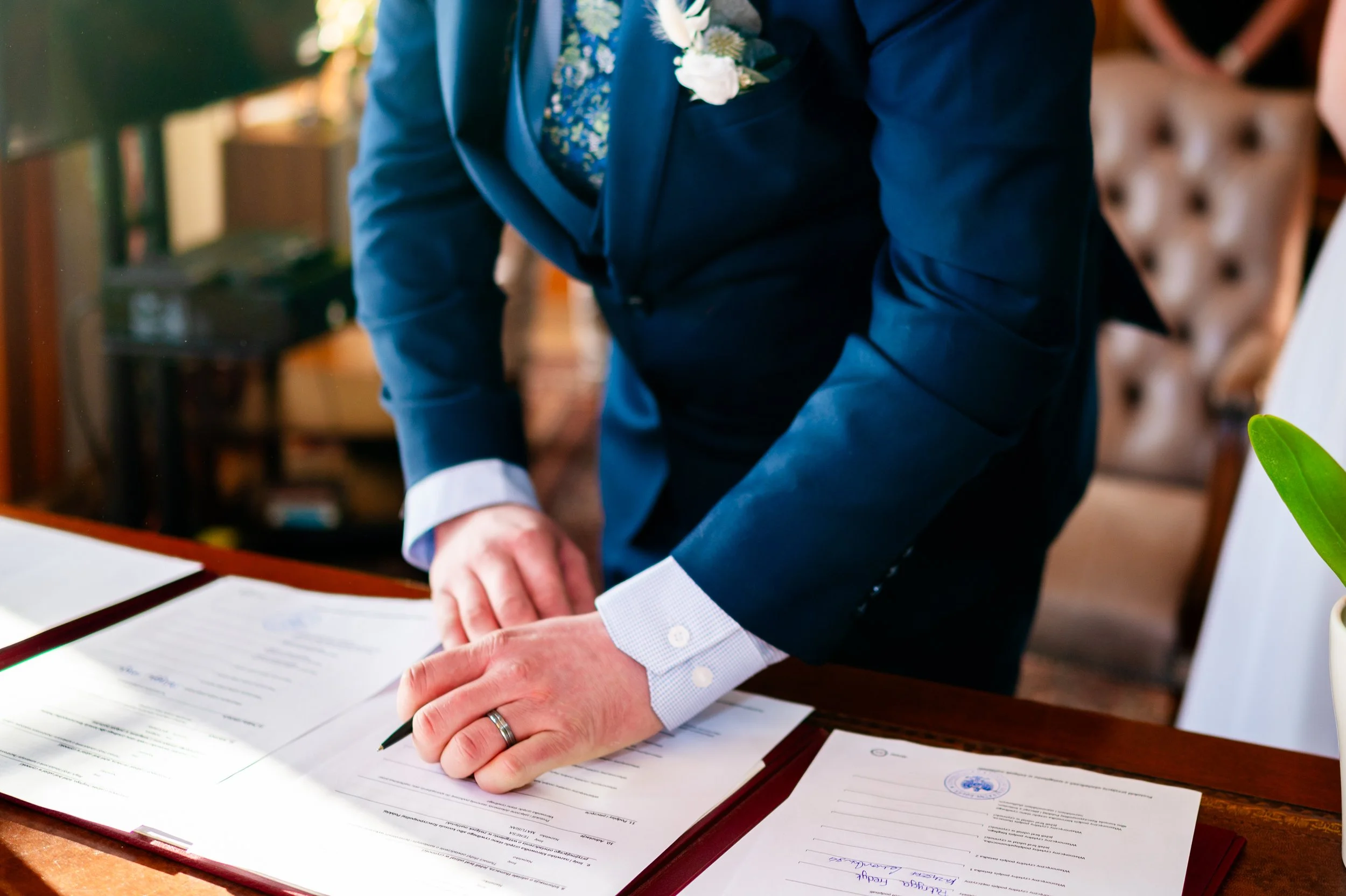 groom wedding ceremony signing papers