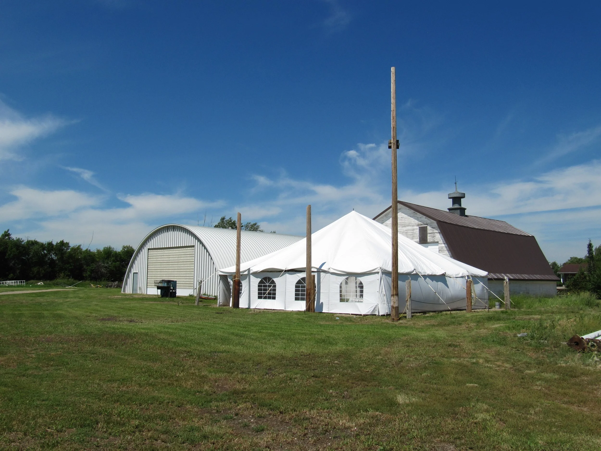Large white event tent prepared for weddings and special celebrations.