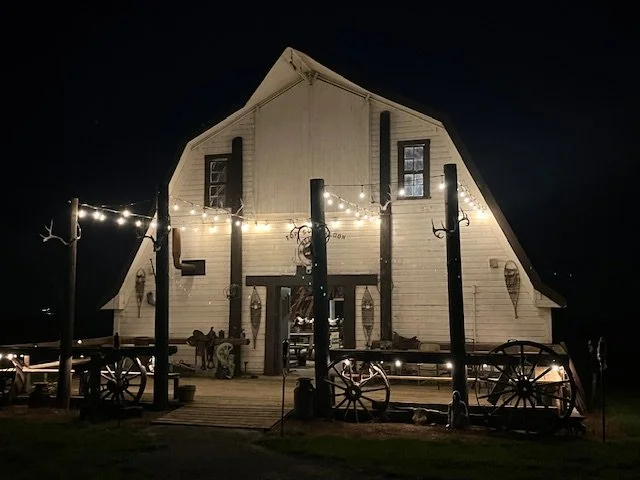 Front of Top Gun Saloon beautifully illuminated at night.
