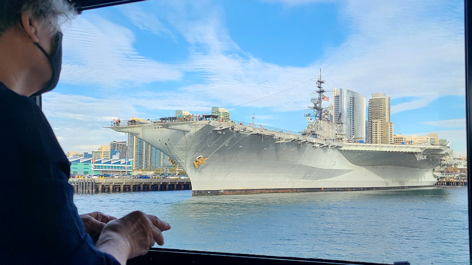 View of the USS Midway Museum from San Diego Bay near the San Diego cruise port, downtown waterfront, and cruise terminal area