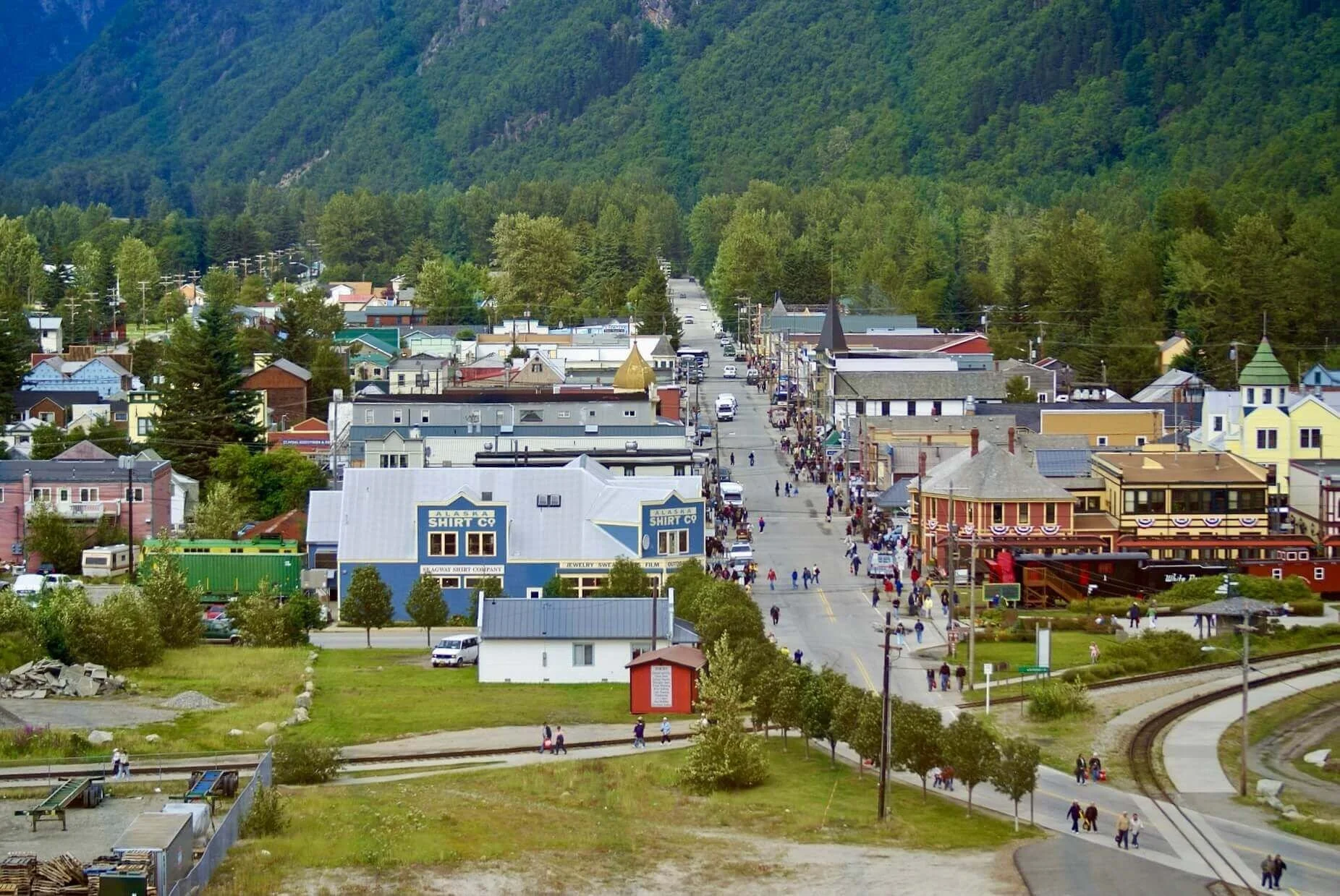 Skagway, Alaska view from the cruise port with Broadway Street, mountain scenery, and White Pass railway tracks