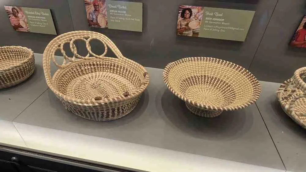 Handwoven Gullah sweetgrass baskets displayed in a Charleston, South Carolina museum near the cruise port