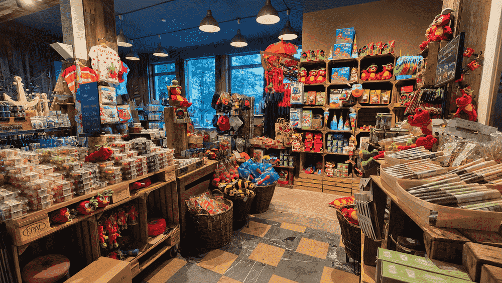 Inside Carl's Pier 7 souvenir shop near the Warnemünde cruise terminal, featuring local souvenirs, strawberry-themed products, and gifts for cruise visitors.