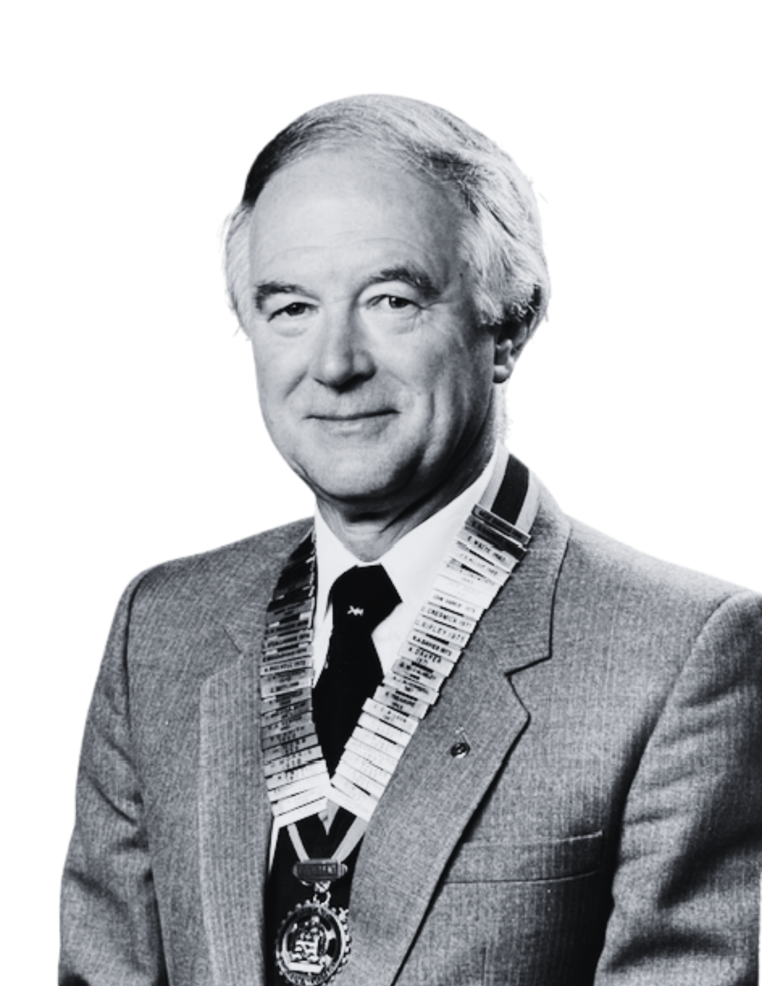 Black and white photo of a man in a suit with a medal and a chain of office around his neck.
