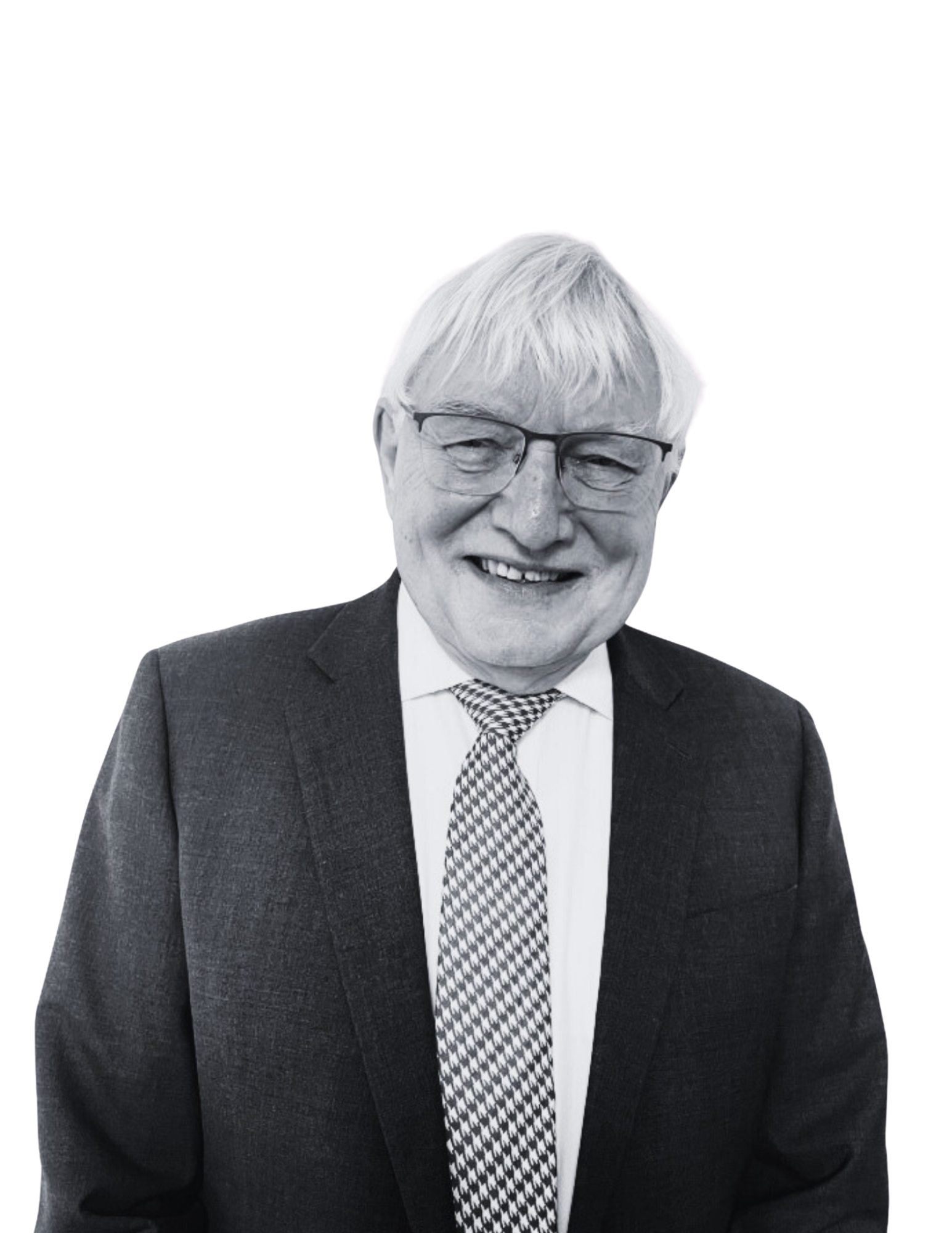 A black and white photograph of an elderly man with glasses, wearing a suit and tie, smiling.