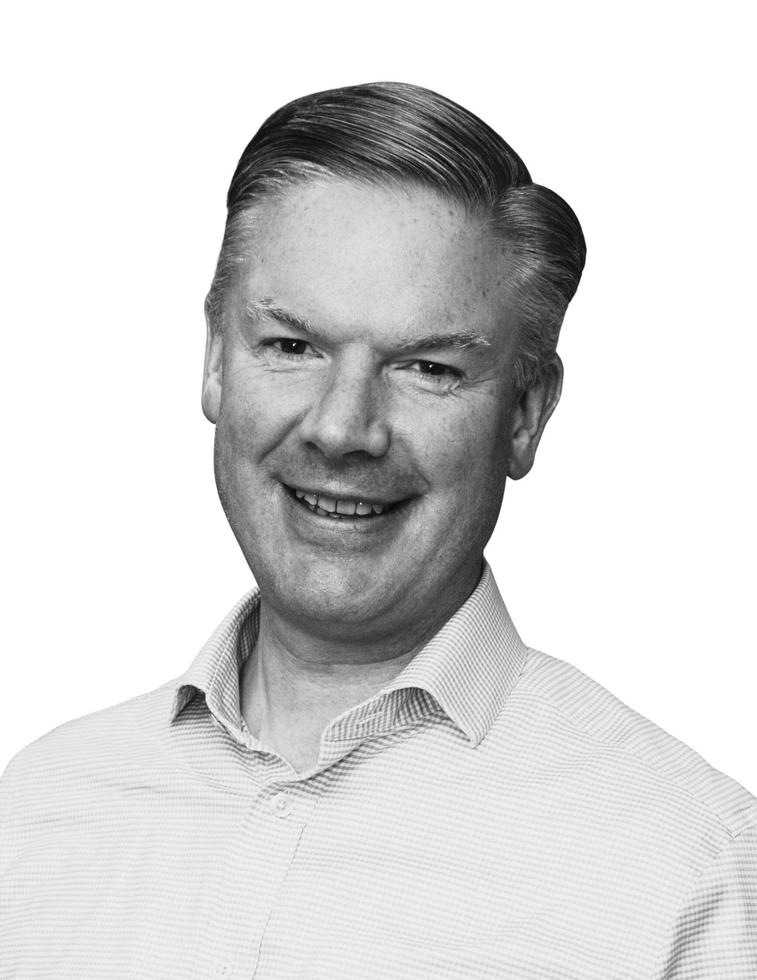 Black and white portrait of a smiling man with styled hair wearing a collared shirt.