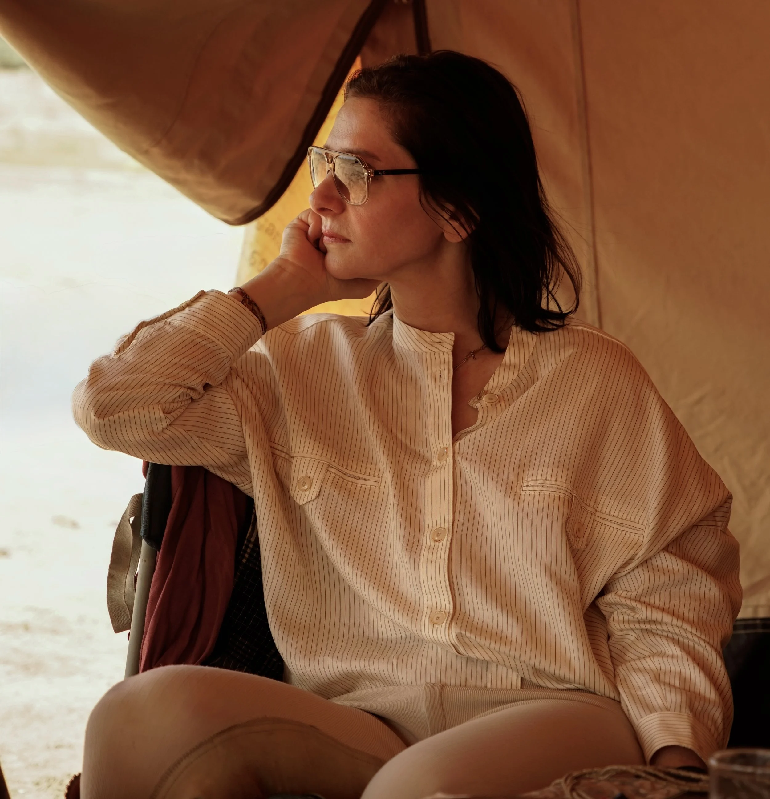 Rebecca with branded shirt in desert tent
