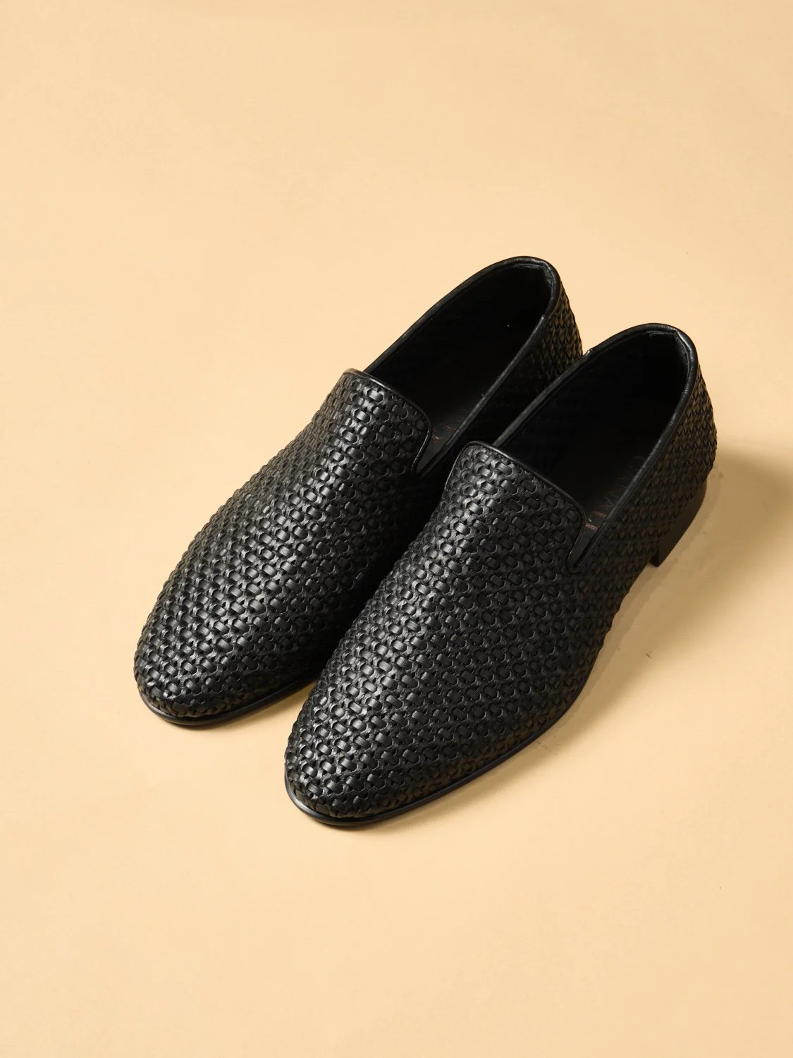 17. Plaited Calfskin Slip-On in Black
