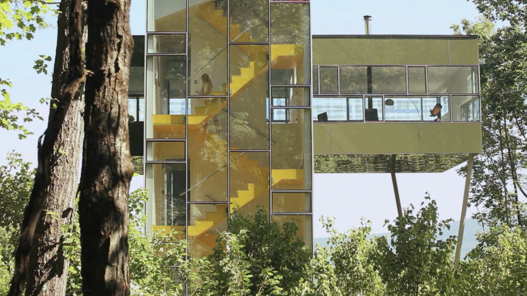 A vacation house is turned on its side and its parts stacked up to access the view. The main living space is cantilevered above in the forest canopy—up in the trees. (2.5 min)