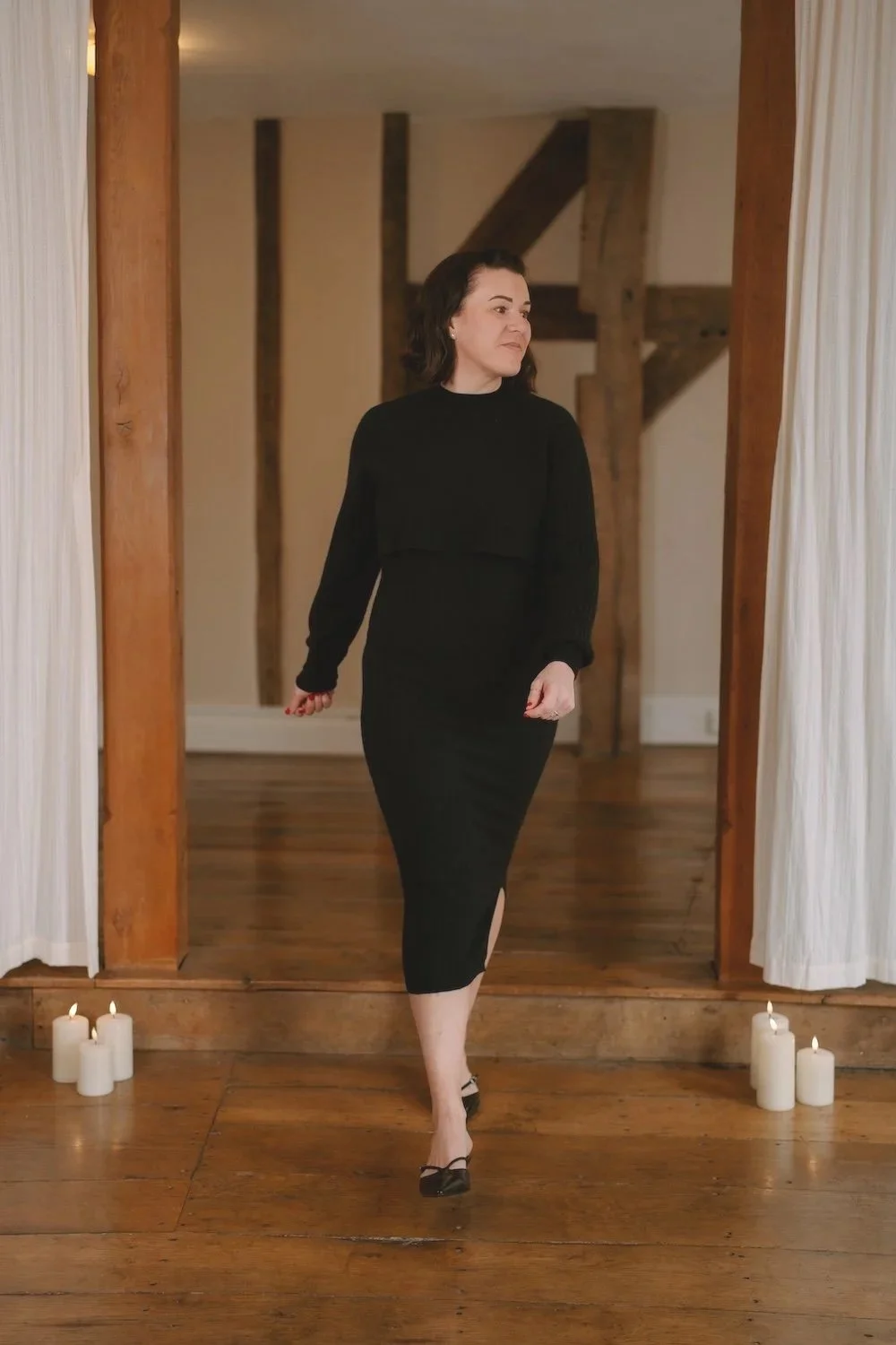 woman in black dress walking