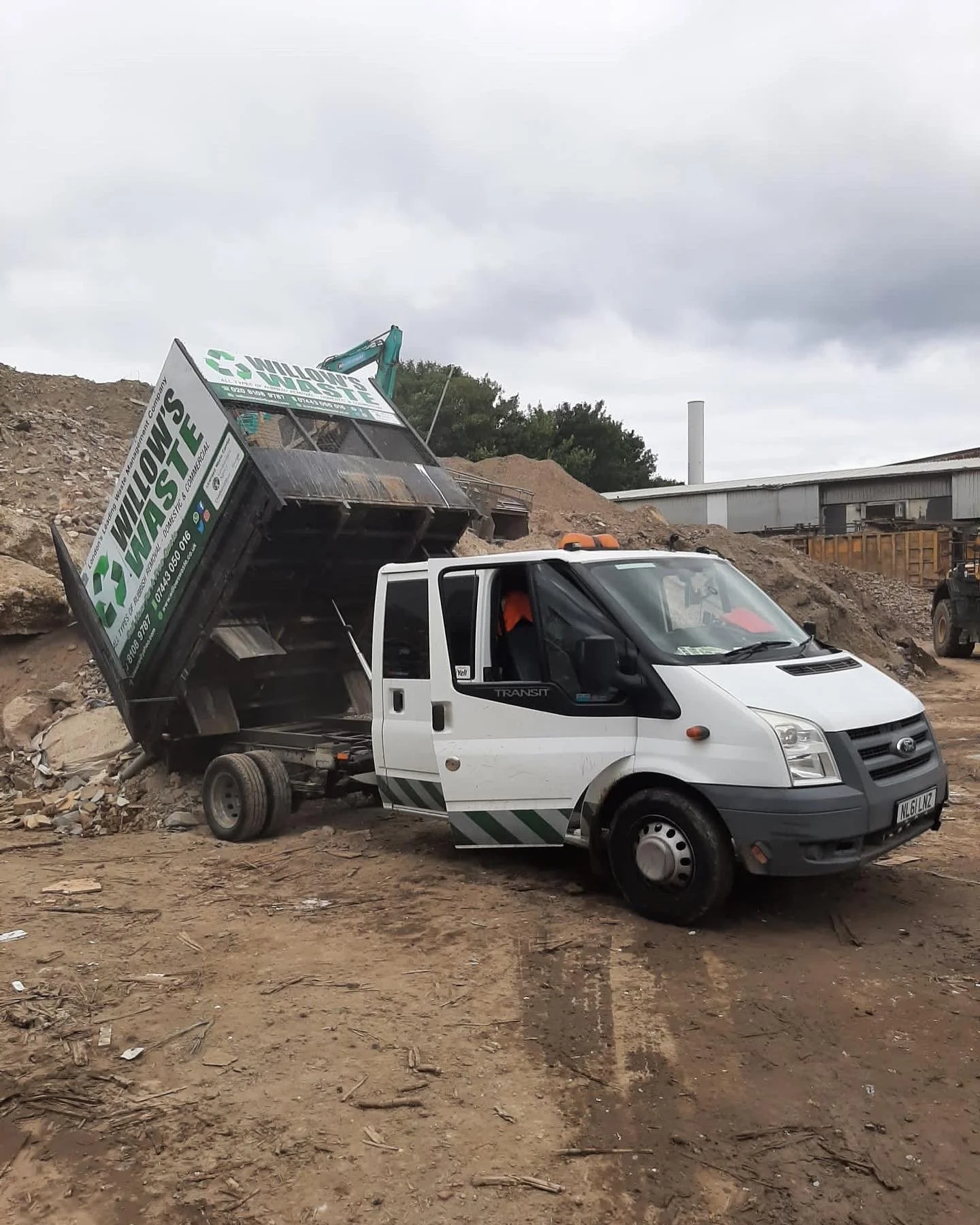 Willows waste tipper van tipping of waste from a job in Clapham sw4 garden waste London's leading waste management company willows waste house clearance