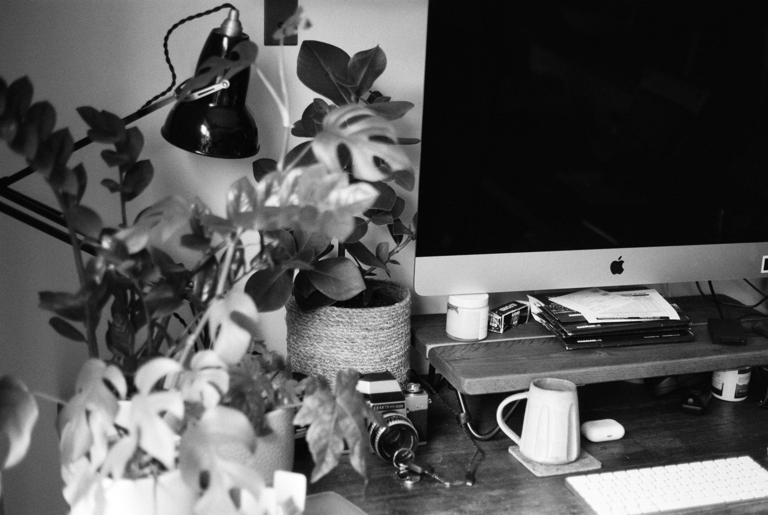 A minimal, clutter-free workspace with a laptop and notebook, representing clarity and focused marketing.