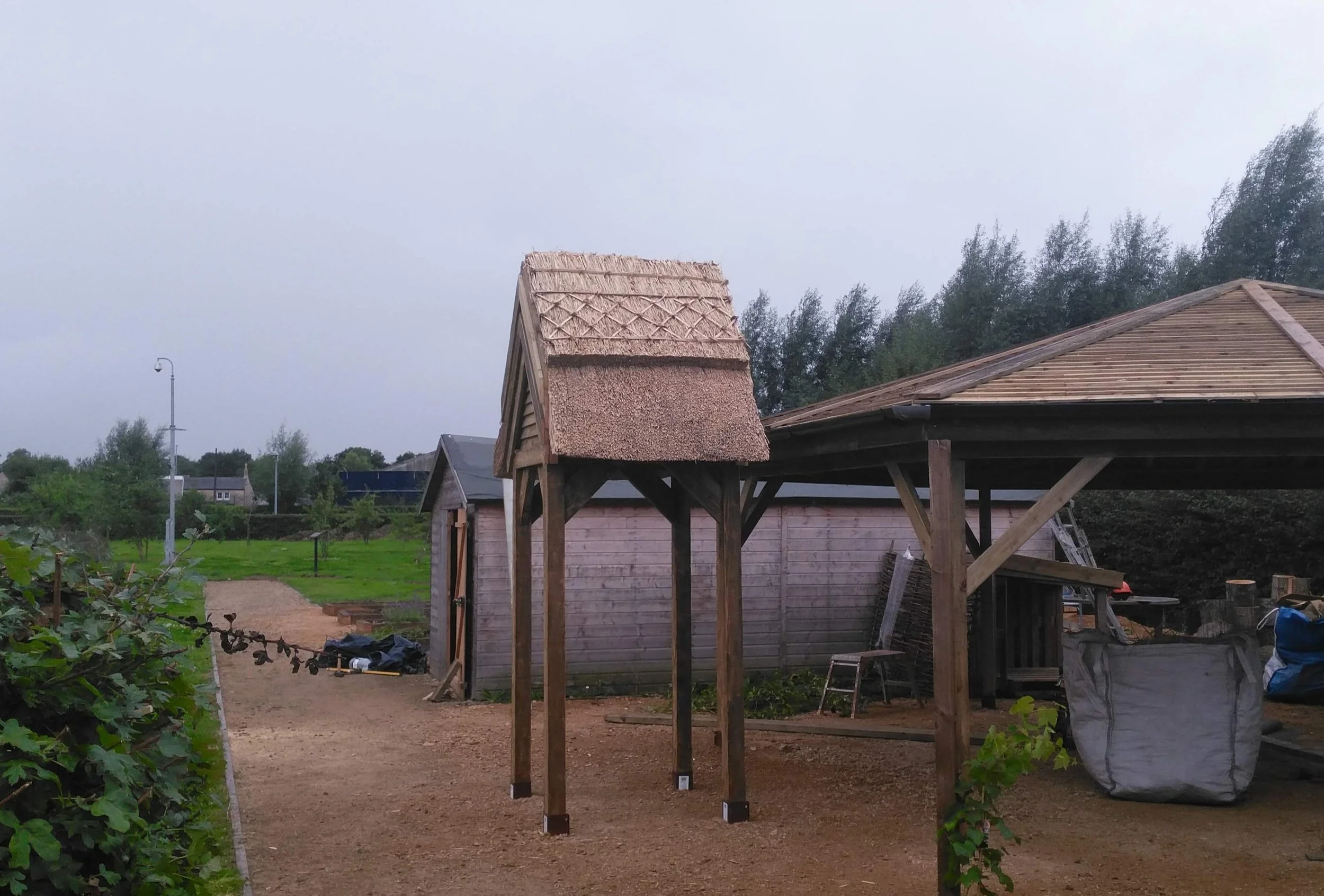 A thatched garden arch structure