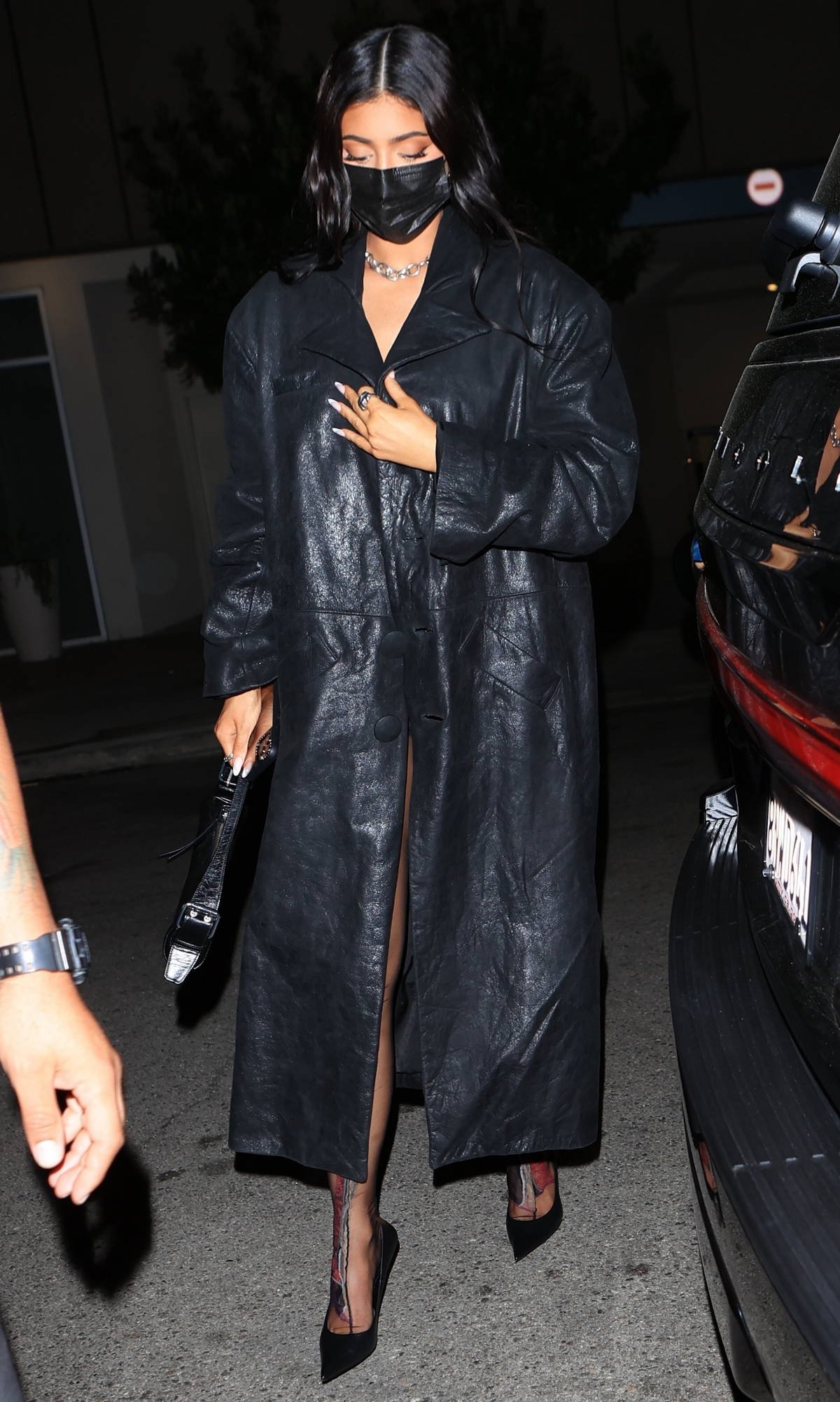 kylie-jenner-covers-up-in-a-black-leather-trench-coat-as-she-leaves-the-nice-guy-in-west-hollywood-california-300421_5.jpeg