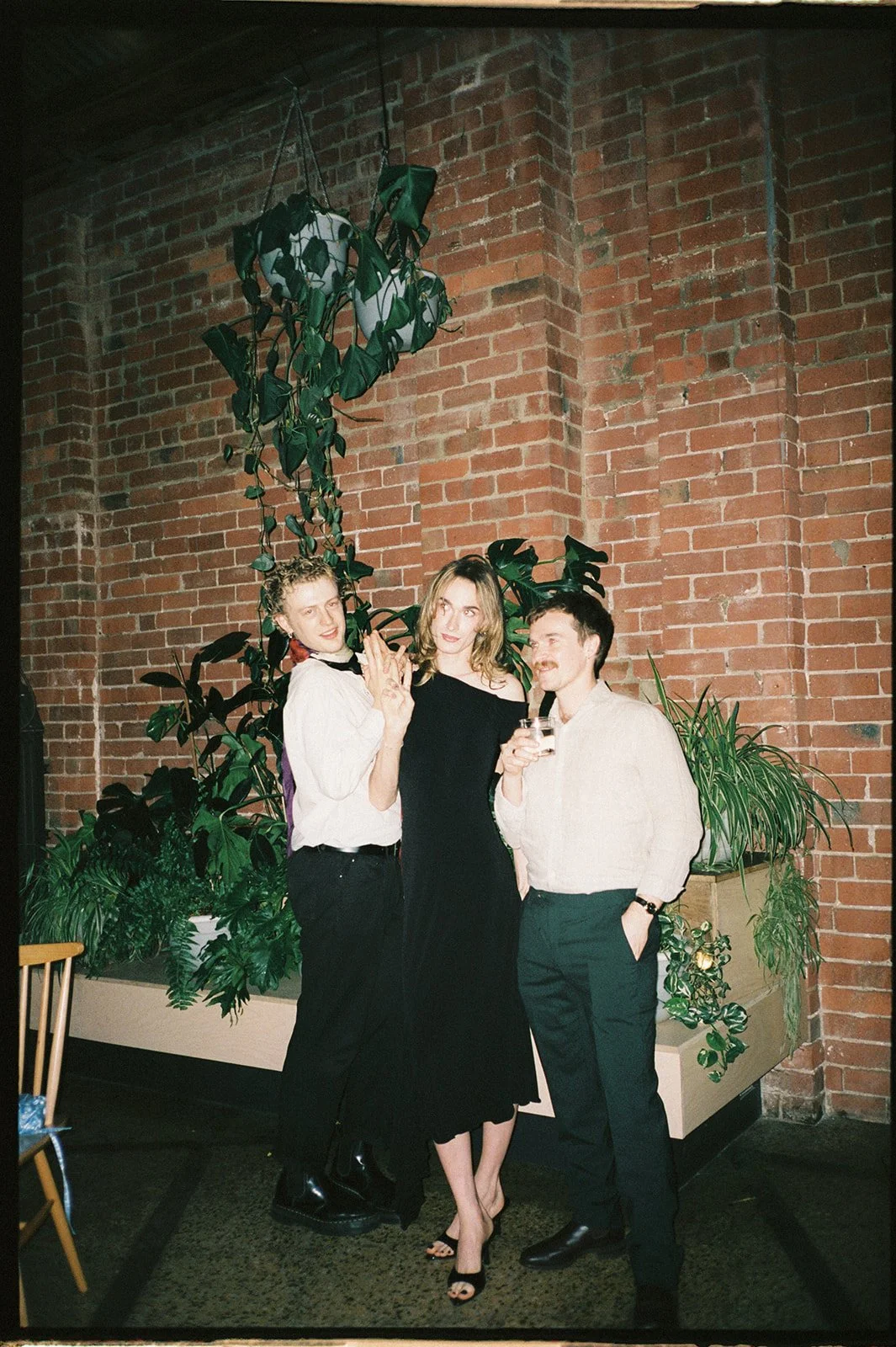 Wedding guests posing at a reception.