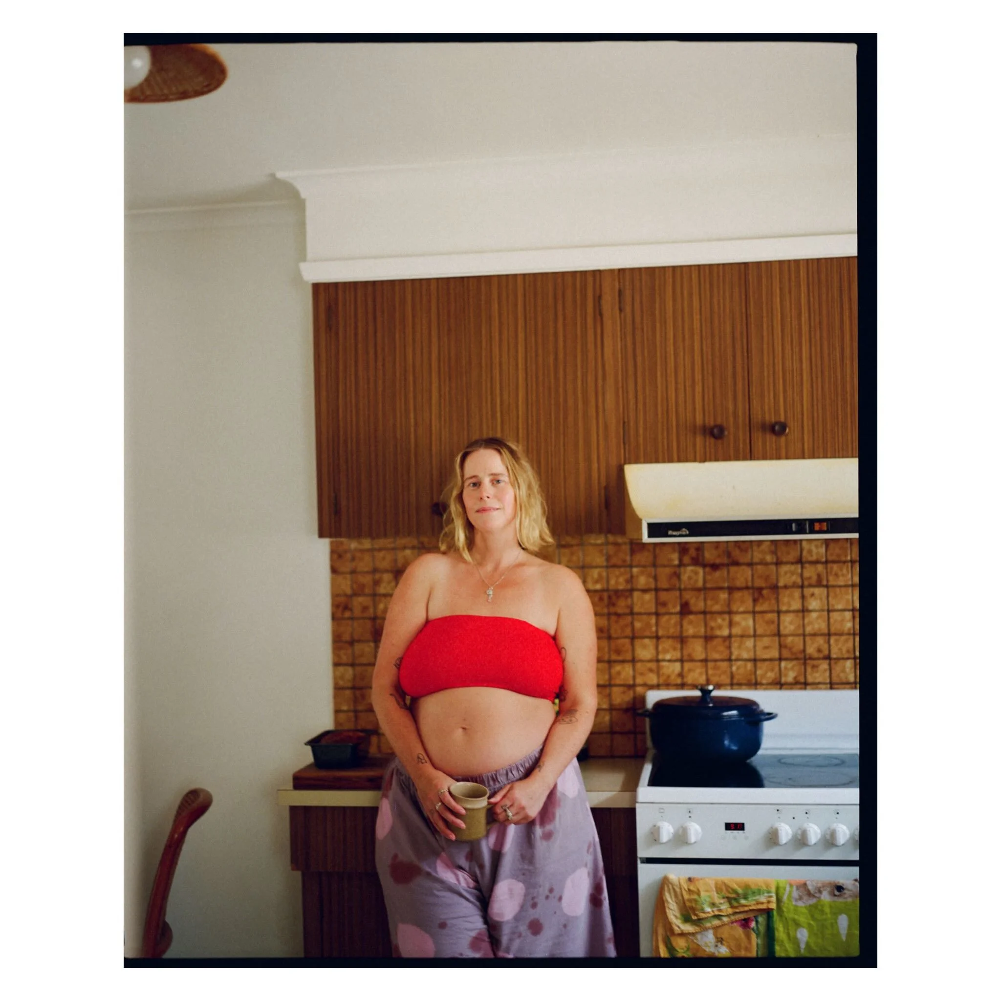Gorgeous Rozzy in her glorious kitchen patiently awaiting Herbies arrival, banana bread and all 🤎 

🏷️ motherhood photography on film