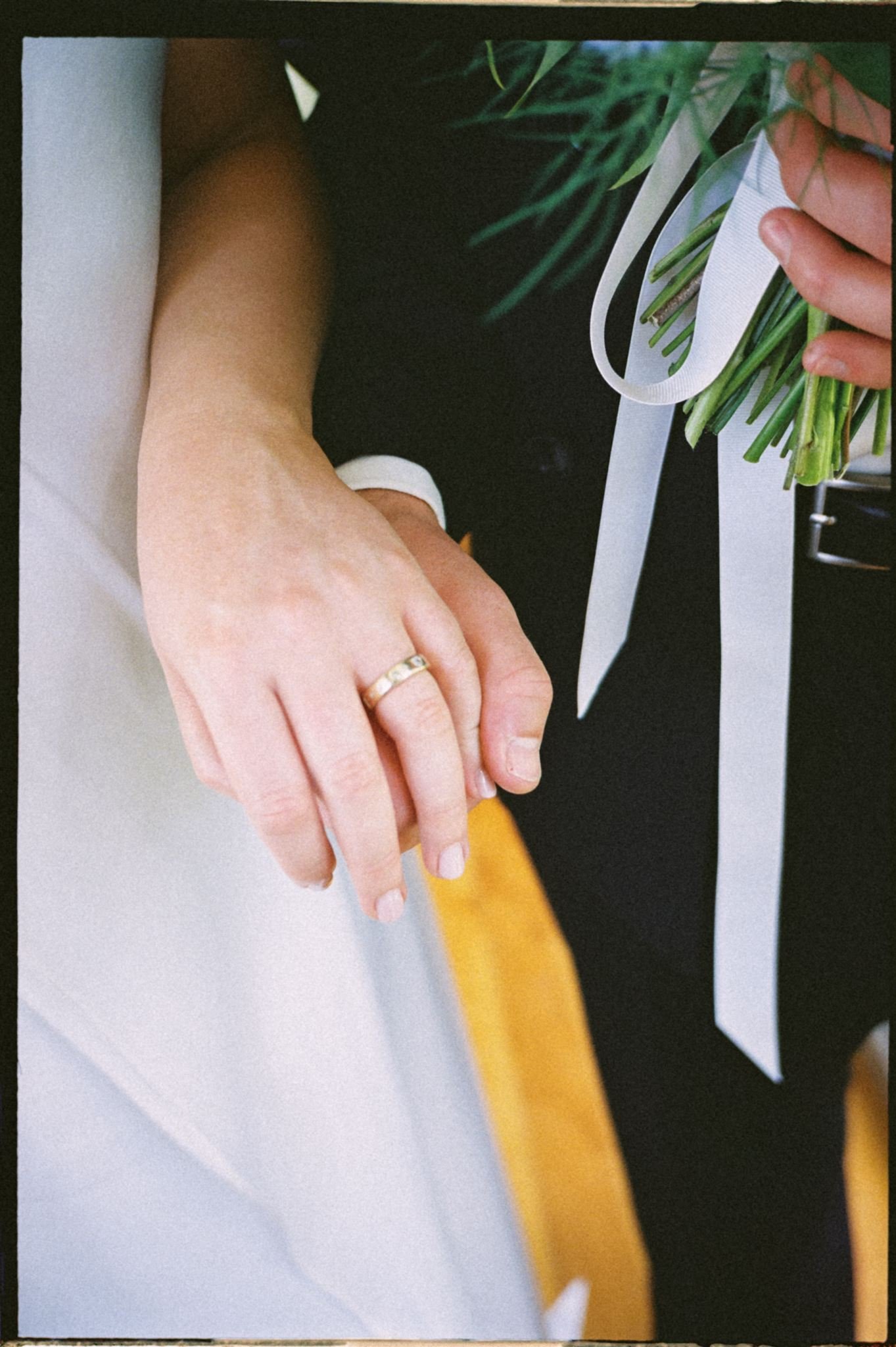 A couple holding handing - Jen Tighe packages for weddings.