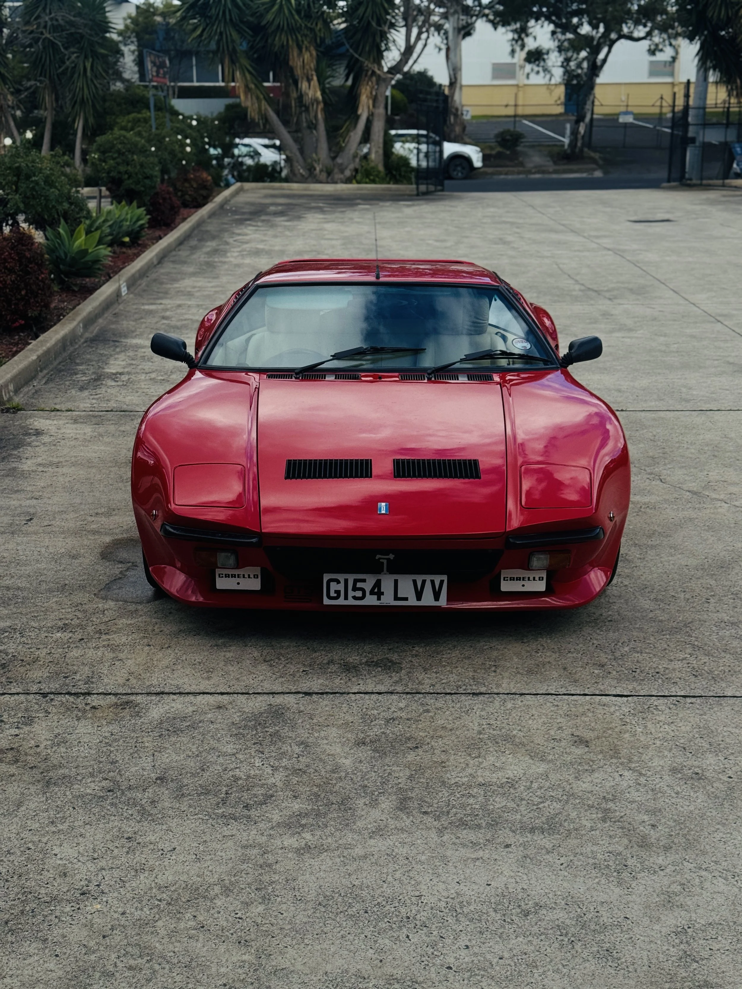 Red De Tomaso Pantera imported vehicle requiring VASS certification in Victoria, Australia, front view showing the classic Italian sports car design