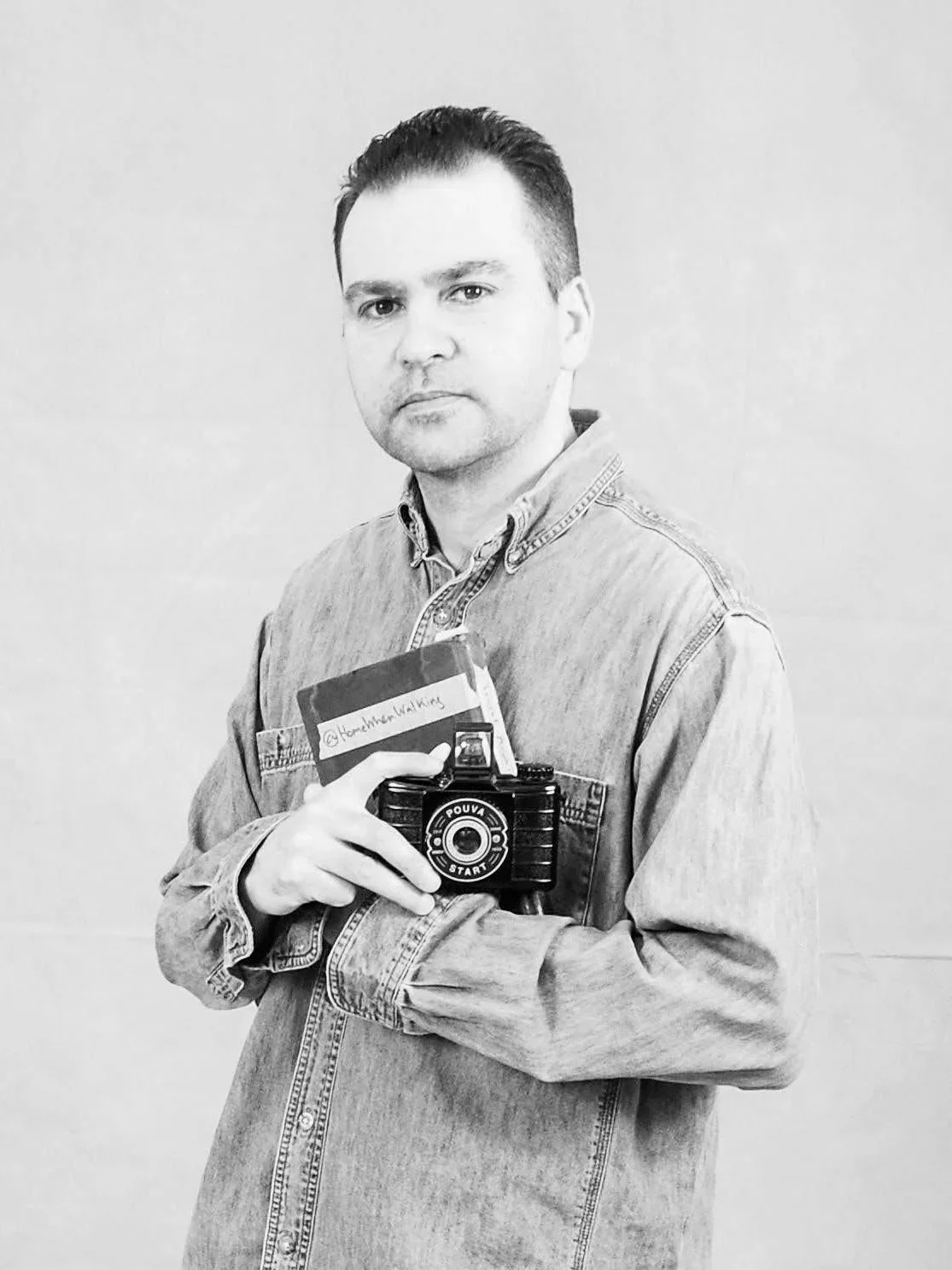 Black and white portrait of Sepa Sama, a Sydney-based artist, photographer, and Doctor of Arts working with walking-based artistic research, photography, writing, and urban study