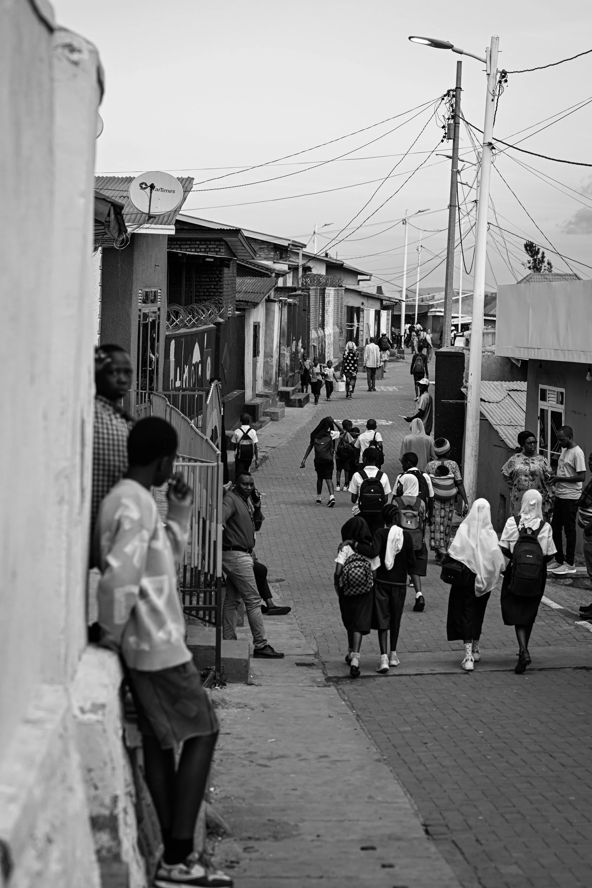 DSC_0810-2-kigali-street-walking-everyday-movement-kigali-rwanda-unknown-year-black-and-white-photography-sepa-sama-photographer-in-sydney-international-contemporary-artist-collector-support-art-funders-support-artists.jpg