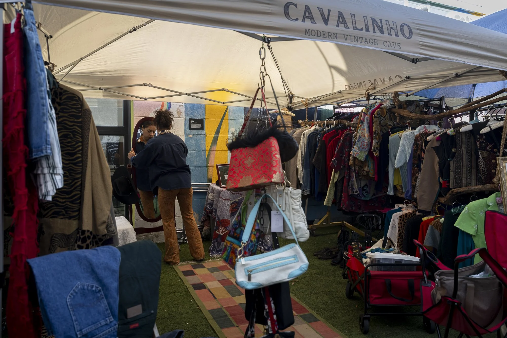 Pre-Flea Market Party: FORT WORTH — Jasmine Herrera, 23, puts the final touches on her booth at Doc’s Records and Vintage’s monthly flea market in Fort Worth on Feb. 21. Herrera and her boyfriend started their vintage clothing company, Cavalinho Mode