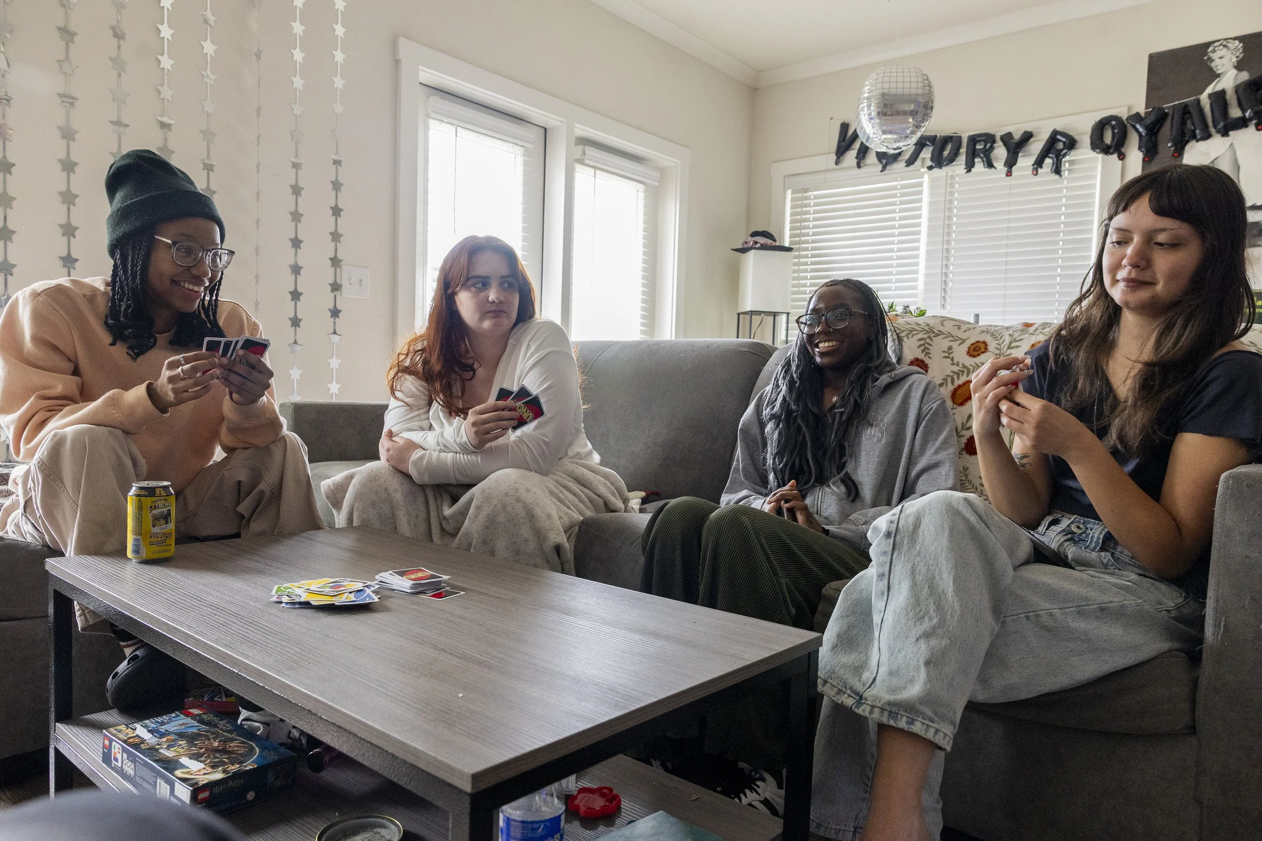 GOOD FRIENDS, GOOD TIMES: Junior Lola Popoola returns to her old apartment to hang out with her former roommates in Denton on April 30. While Popoola doesn’t live with them anymore, they all often get together to play games, watch movies, or go out. 