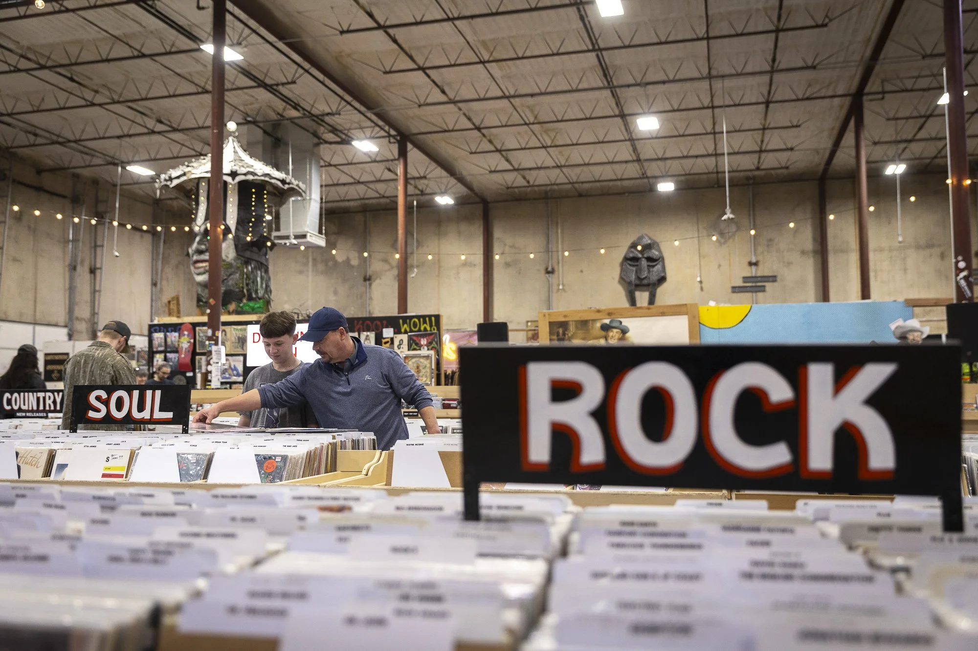Bonding Time: FORT WORTH -- Brian Childers, 48, and his 14-year-old son, Aidyn, browse through records at Doc’s Records and Vintage’s monthly flea market in Fort Worth on Feb. 21. Childers woke up at 7 a.m. to beat the crowds.
