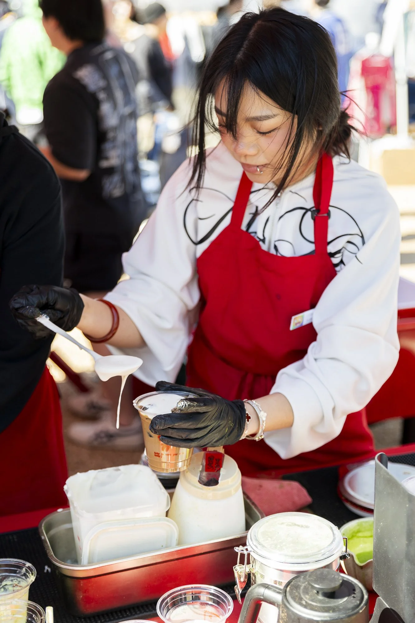 Lucky You, Lucky Yu: FORT WORTH -- R7. uby Jeong, 21, prepares a Saigon coffee at Doc’s Records and Vintage’s monthly flea market in Fort Worth on Feb. 21. The Lucky Yu tent, where Jeong worked, served coffee, matcha, and baked goods.