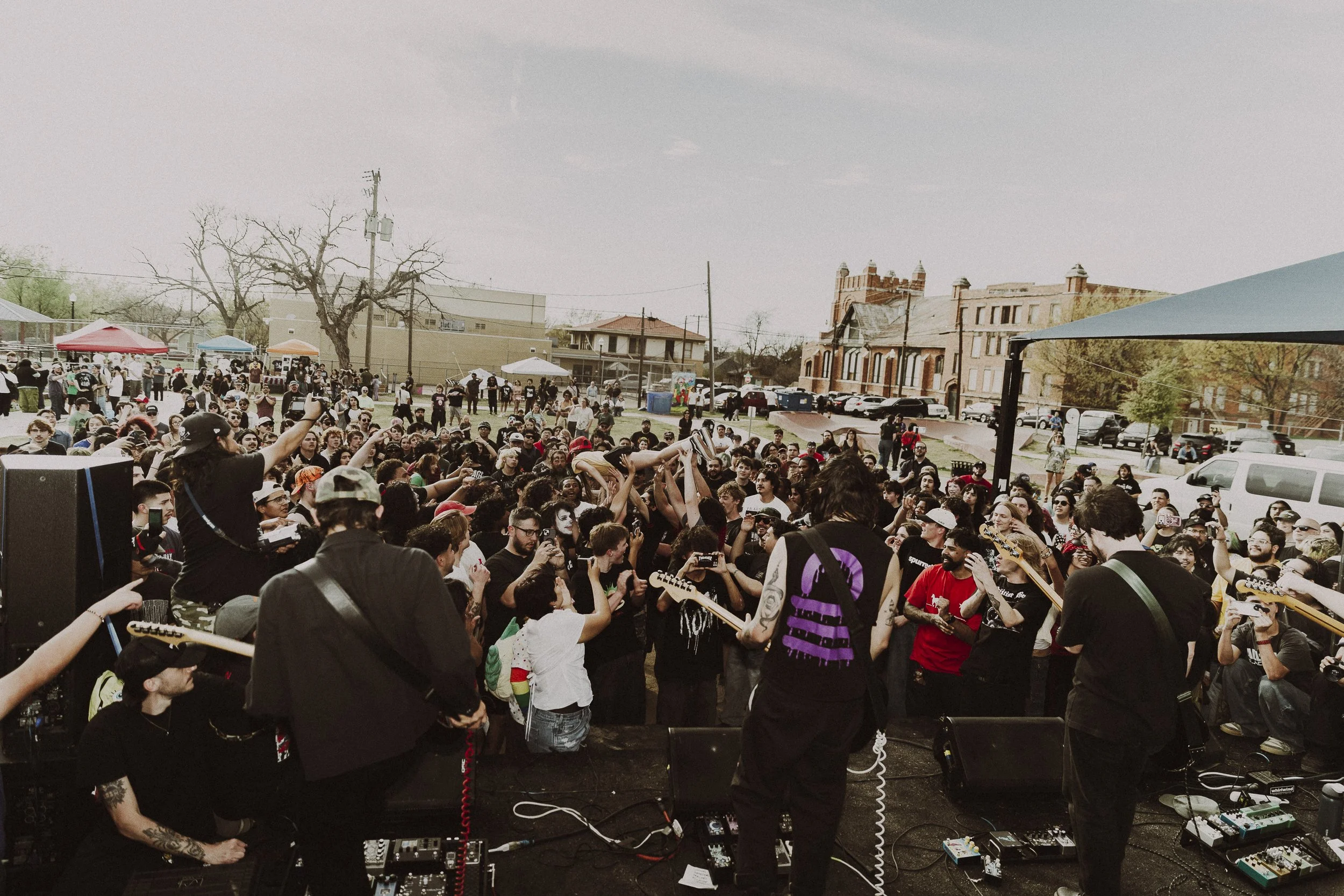Welcome to the Carnival: Trauma Ray plays to a crowd of over 700 people in Fort Worth on March 14. The free “carnival” spanned over seven hours and brought together hundreds of people to witness the power of community.