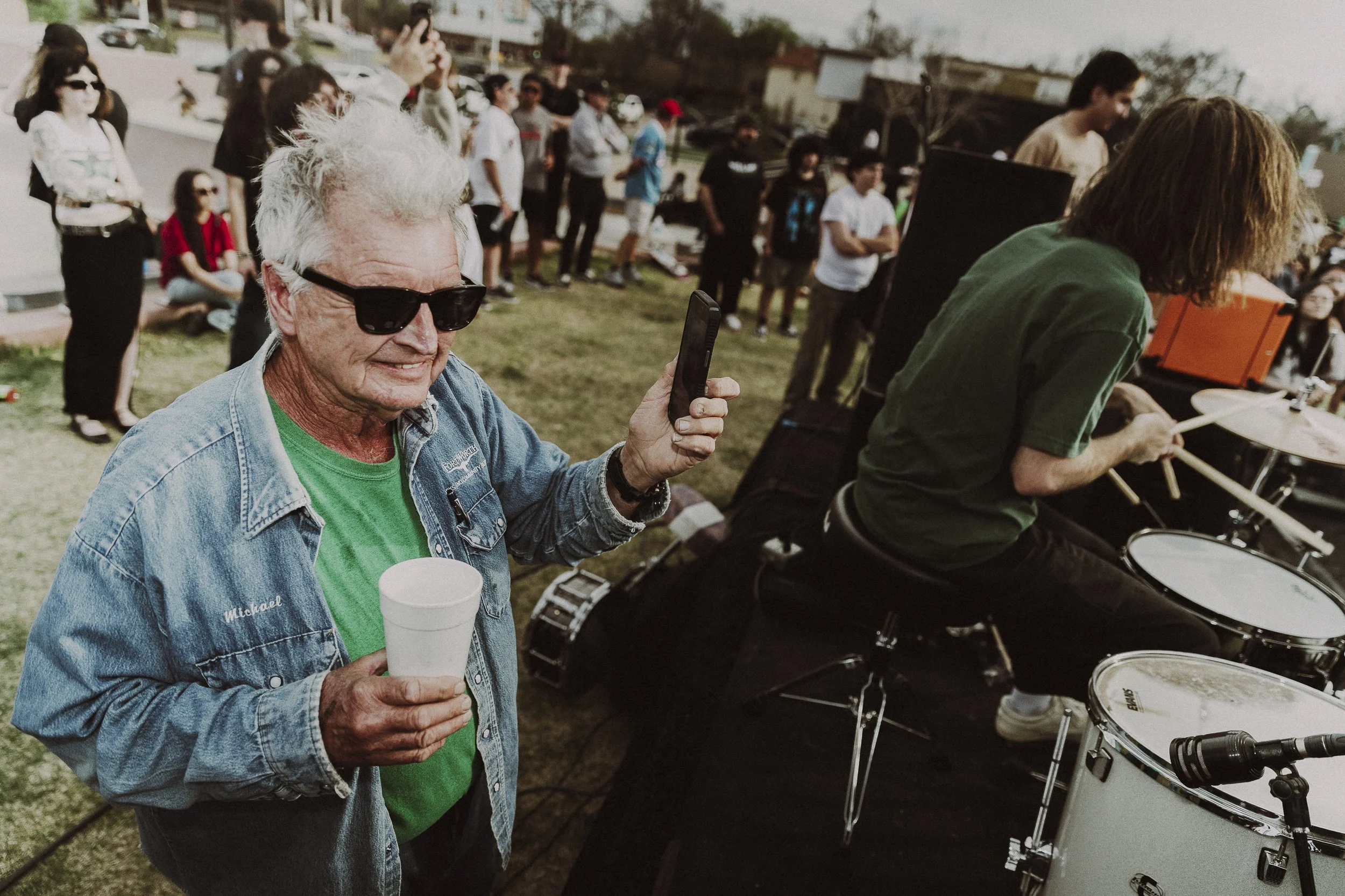 Handheld Drum Cam: Christopher Etter, 72, takes note of Nick Bobotas’s drum skills in Fort Worth on March 14. The music lover heard the music from his house down the street and decided to join the festivities.
