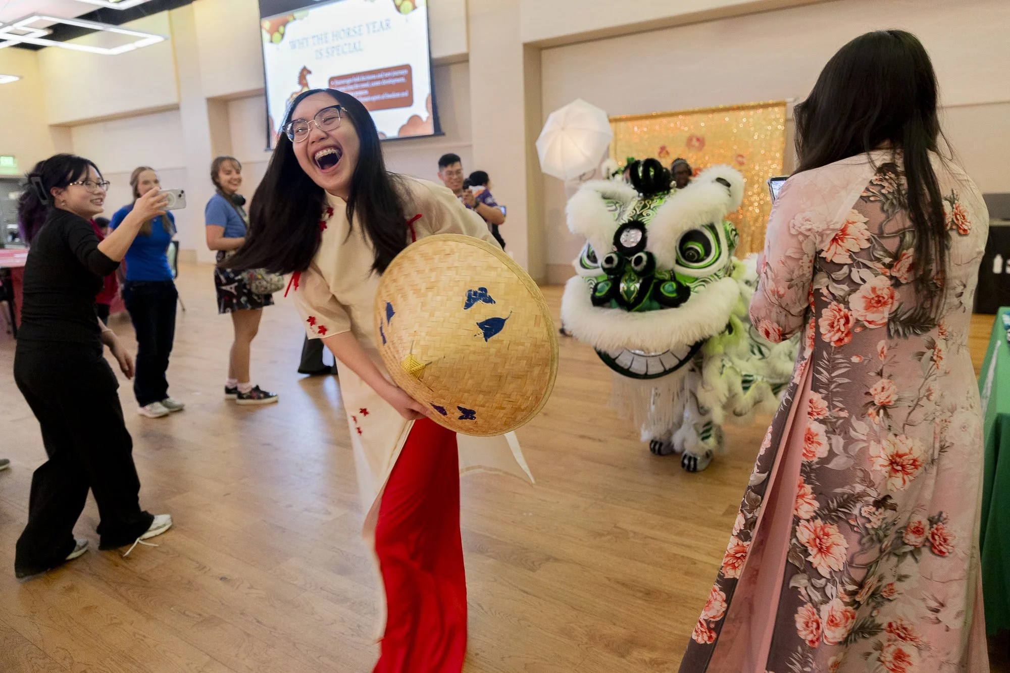 All Smiles: DENTON — Senior Amber Nguyen is all smiles after successfully wrestling her douli from a lion at the UNT Lunar New Year celebration in the Emerald Ballroom on Feb. 16. The event ended with students getting the opportunity to pet the lions
