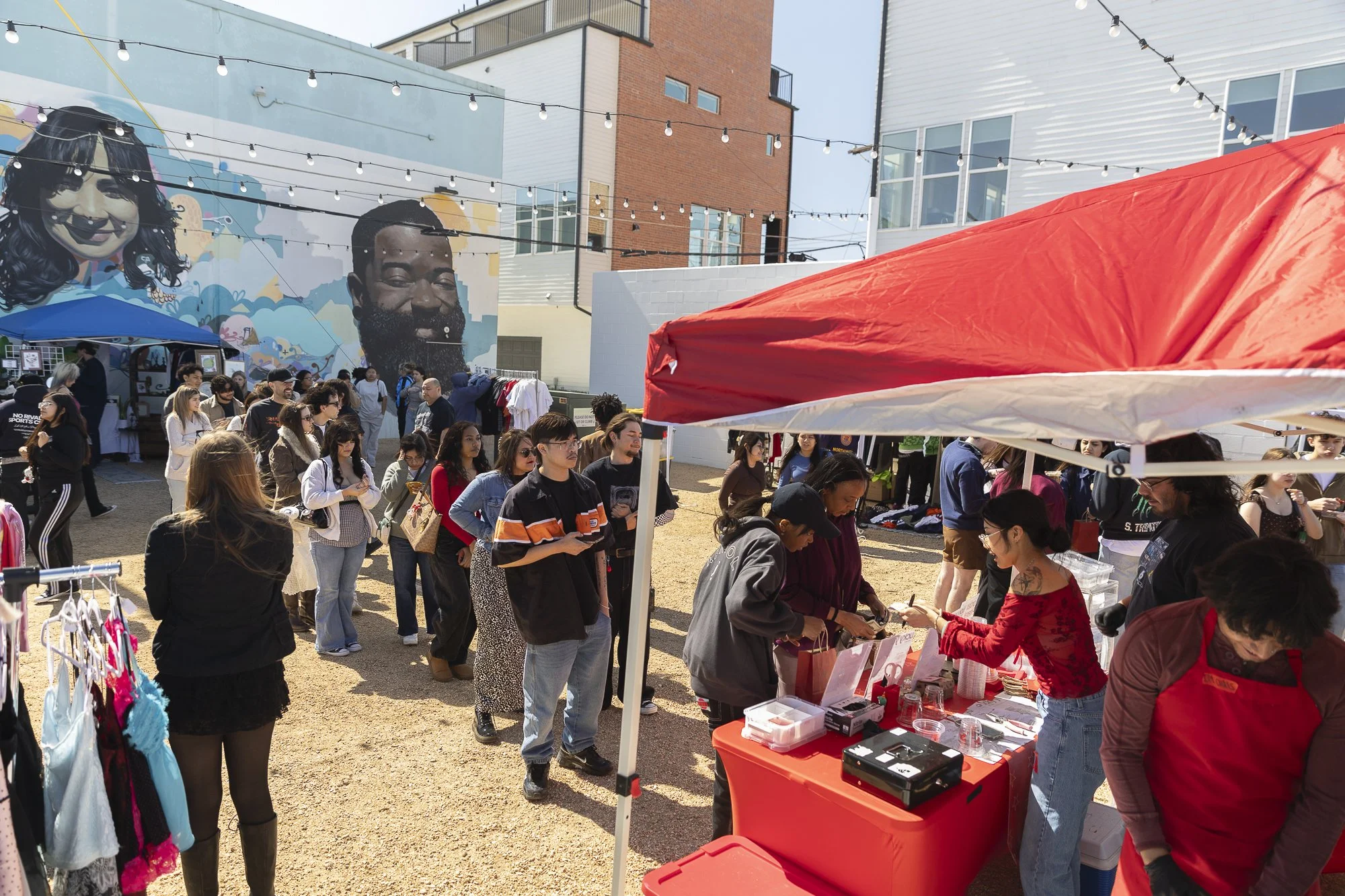 Lined Up At Lucky Yu: FORT WORTH -- The employees of Lucky Yu move through their long line of customers at Doc’s Records and Vintage’s monthly flea market in Fort Worth on Feb. 21. The pop-up tent sold out of all of their drinks after only three hour