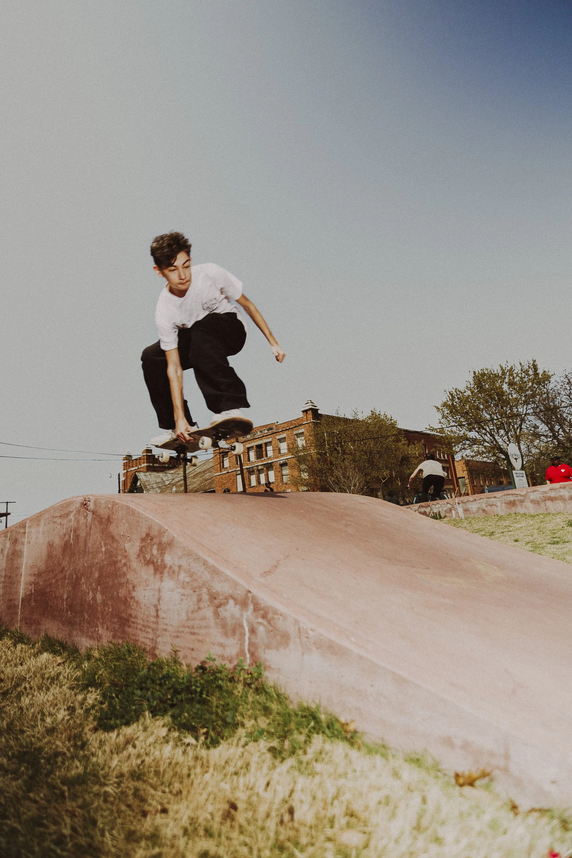 Catching Wind: Wyatt Martinez, 15, catches wind as he goes over a pump at Fire Station Skate Park Plaza on March 14. Martinez was a participant in the skateboarding trick competition at the “Carnival” that Trauma Ray put on in collaboration with Magn