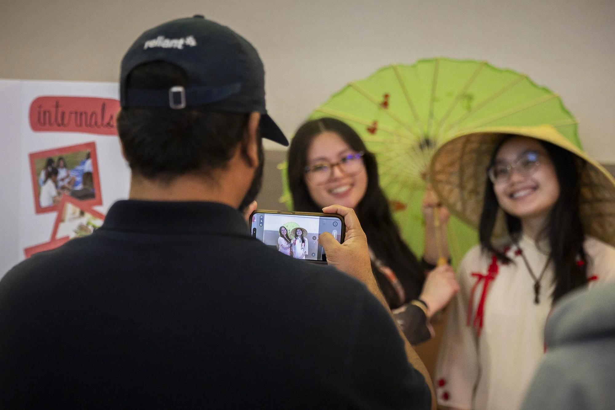 Say Cheese!: DENTON — Senior Miah Taylor, president of the Vietnamese Student Association, and senior Amber Nguyen, secretary, smile for the camera at the UNT Lunar New Year celebration in the Emerald Ballroom on Feb. 16. The organization had a table