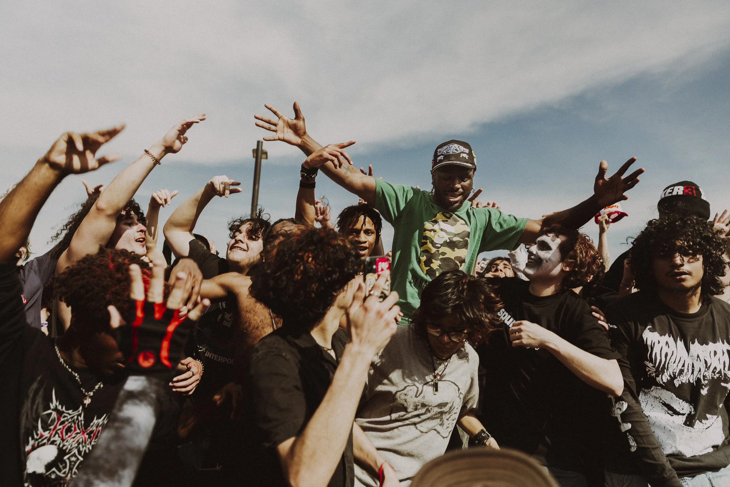 King of the World: Fans swarm Jakaree Murphy, lead vocalist of the rap-metal band Empty Shell Casing, as he performs the final song of their set in Fort Worth on March 14. The Fort Worth six-piece was one of four other bands that opened for Trauma Ra