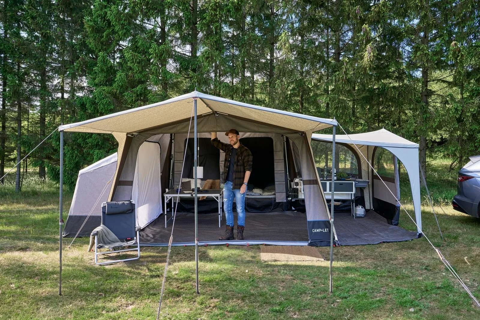A man standing inside a Camp-let Earth