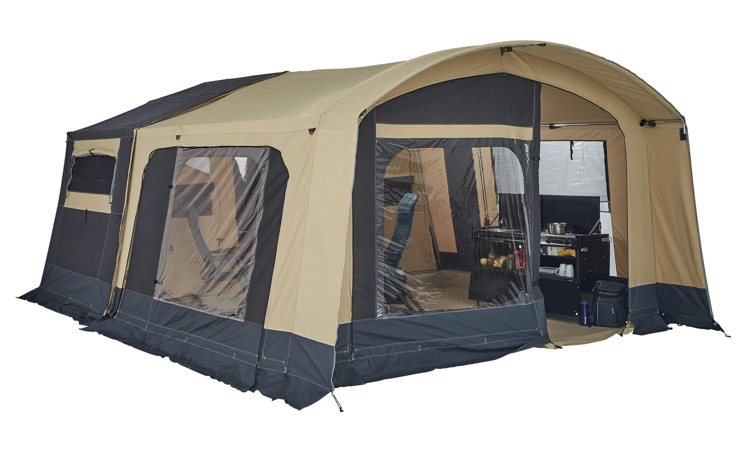 A large beige and black Trigano Galleon set up with interior furniture, window flaps, and a screened porch area.