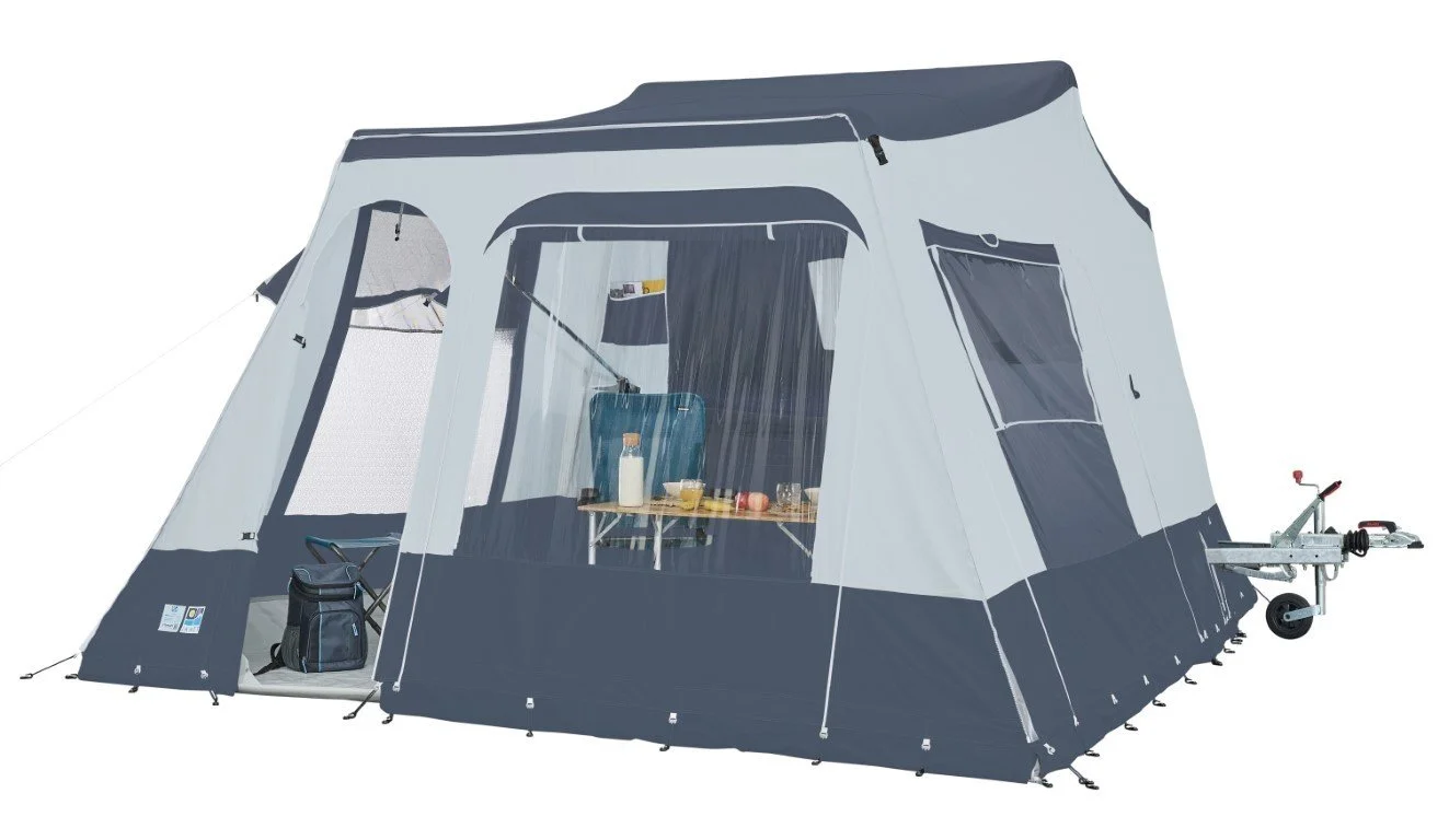 A Jamet Compact gray and black camping tent with a driveway and a trailer hitch on the front, set up for outdoor camping.