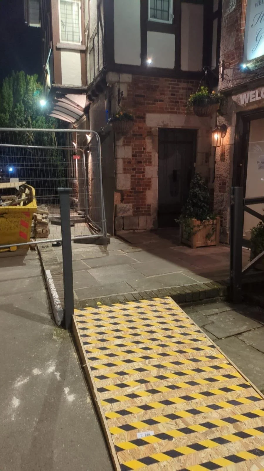 Heras fencing and temporary access ramp at a pub in Polegate