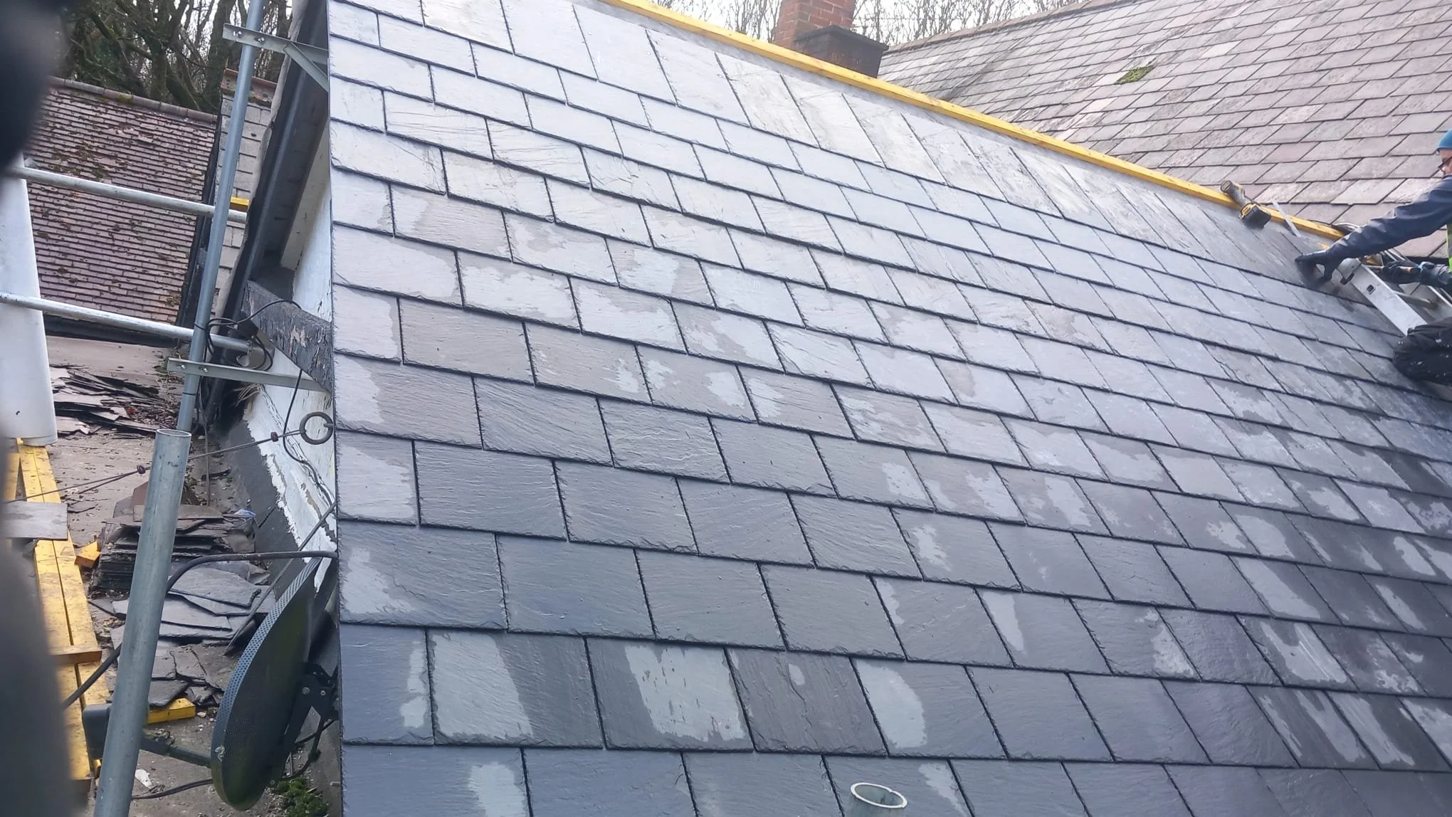 The finished slate roof of a Surrey pub
