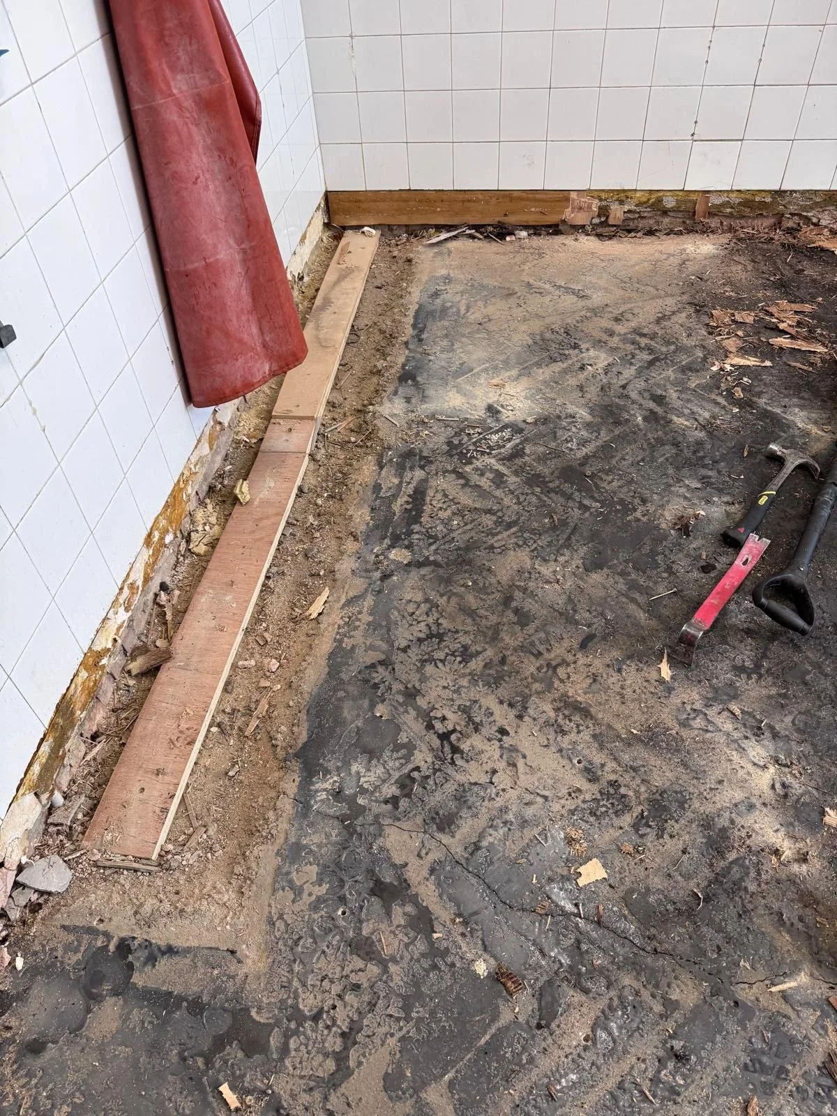 Image: Old flooring being removed at a  commercial kitchen 