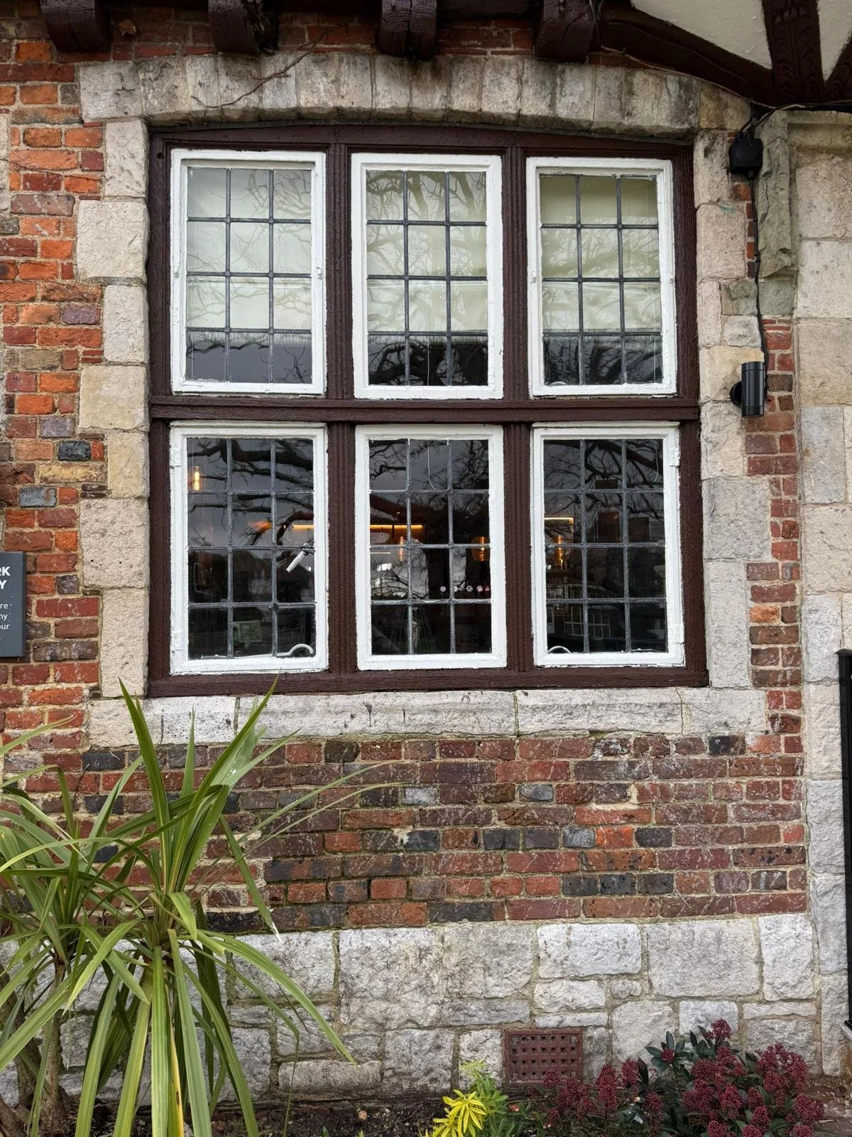 Finished repair to the brick and stone frontage of a pub in Polegate