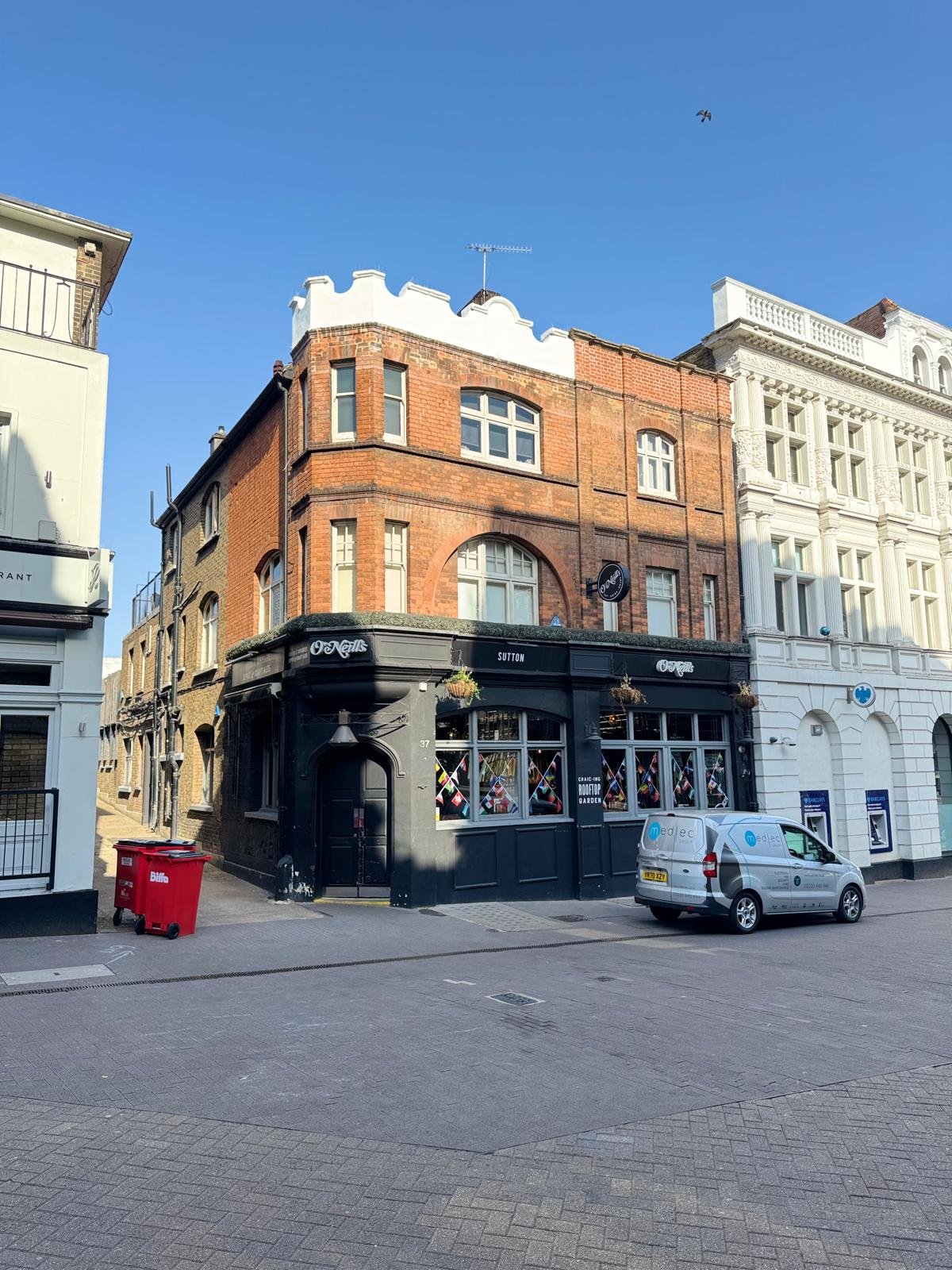 Victorian corner pub in Sutton with its ornamental parapet restored and the scaffolding down after Medlec’s wall rebuild